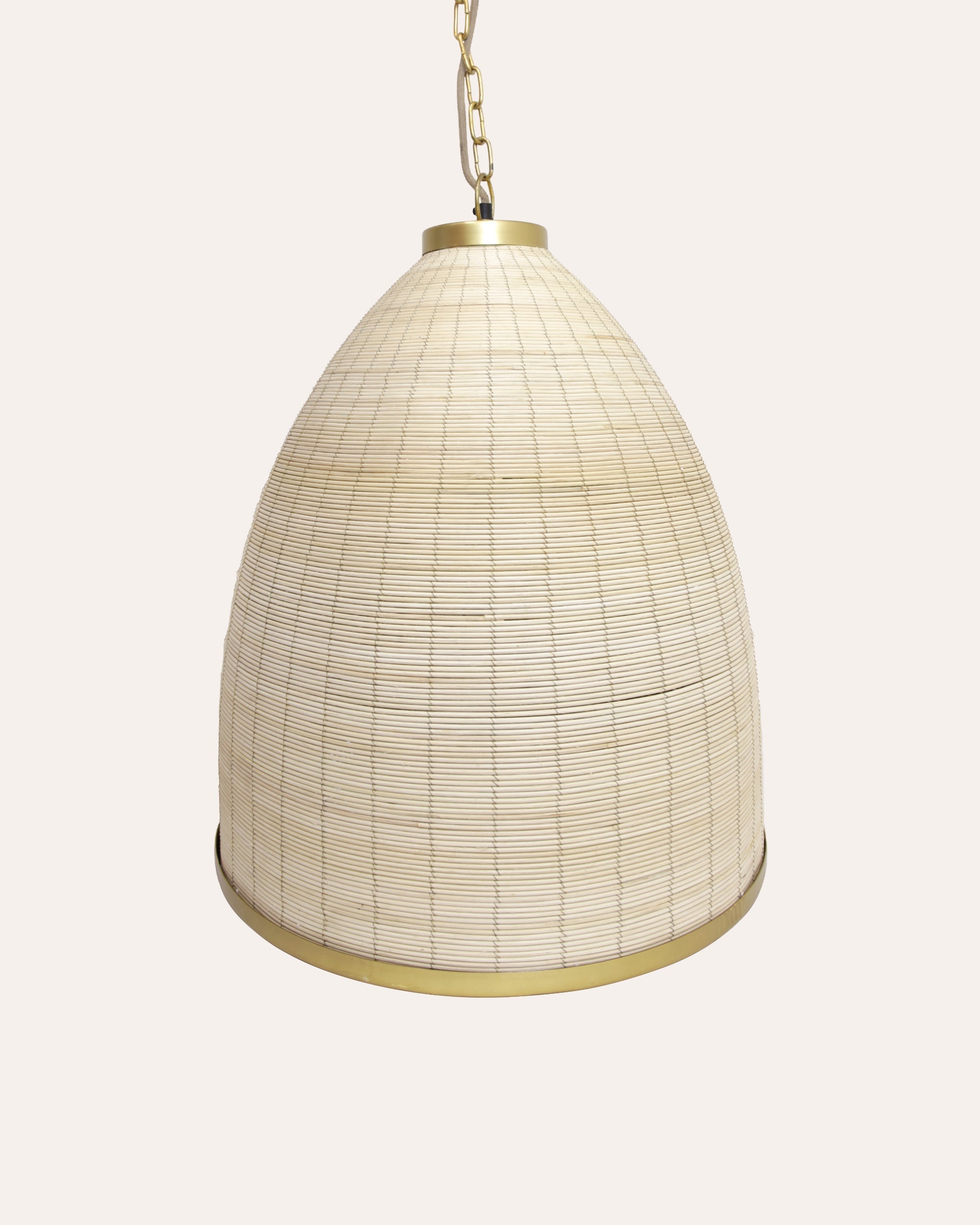 A beige rattan pendant lampshade with a brass base and ceiling chain, designed to hang from the ceiling.