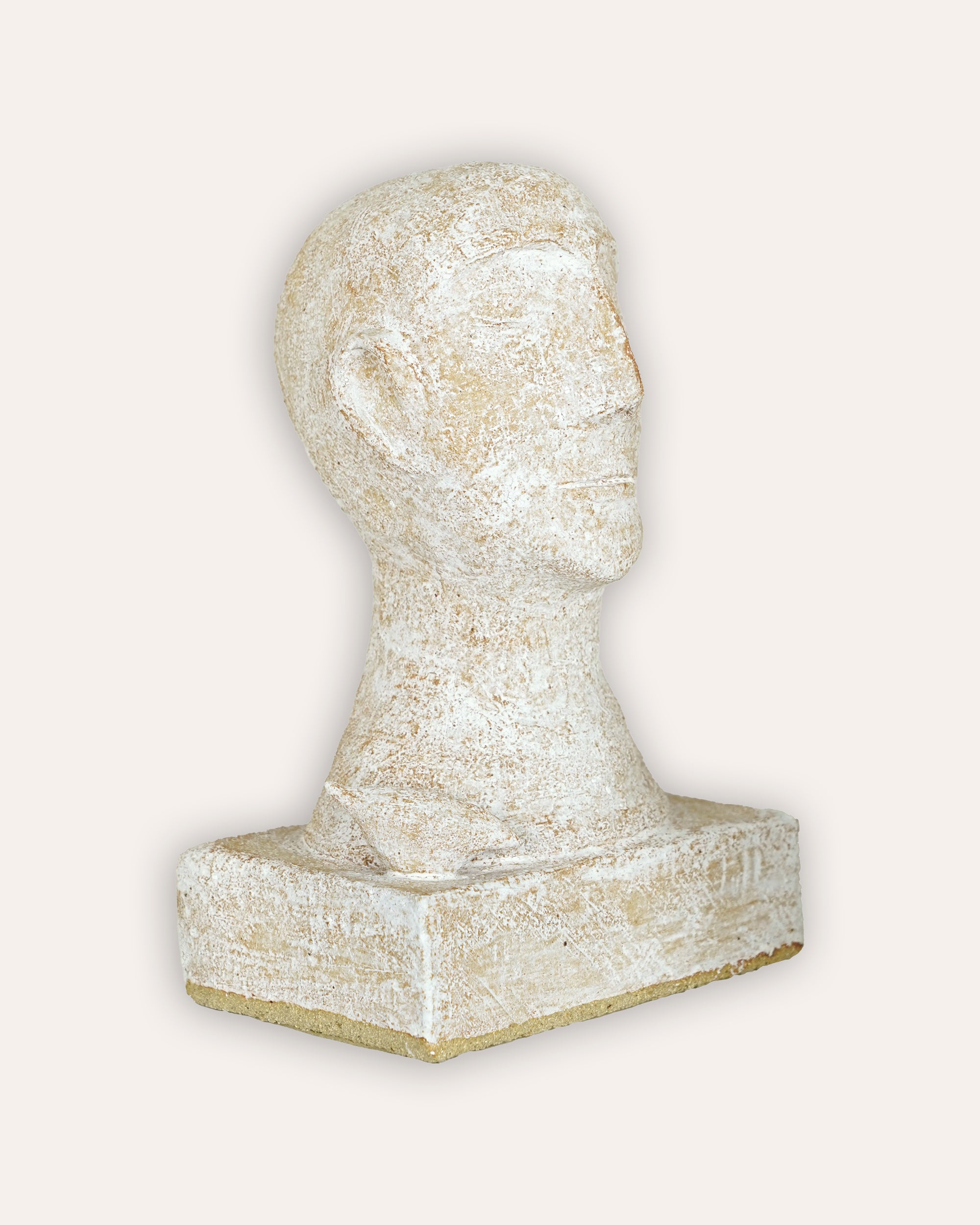 Decorative stone head on a white background