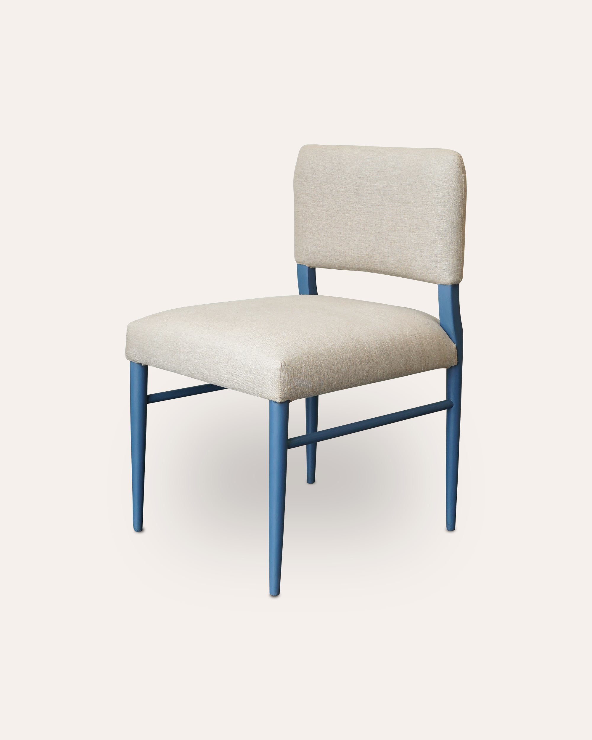 Chair with beige seat and backrest and blue metal legs on a white background