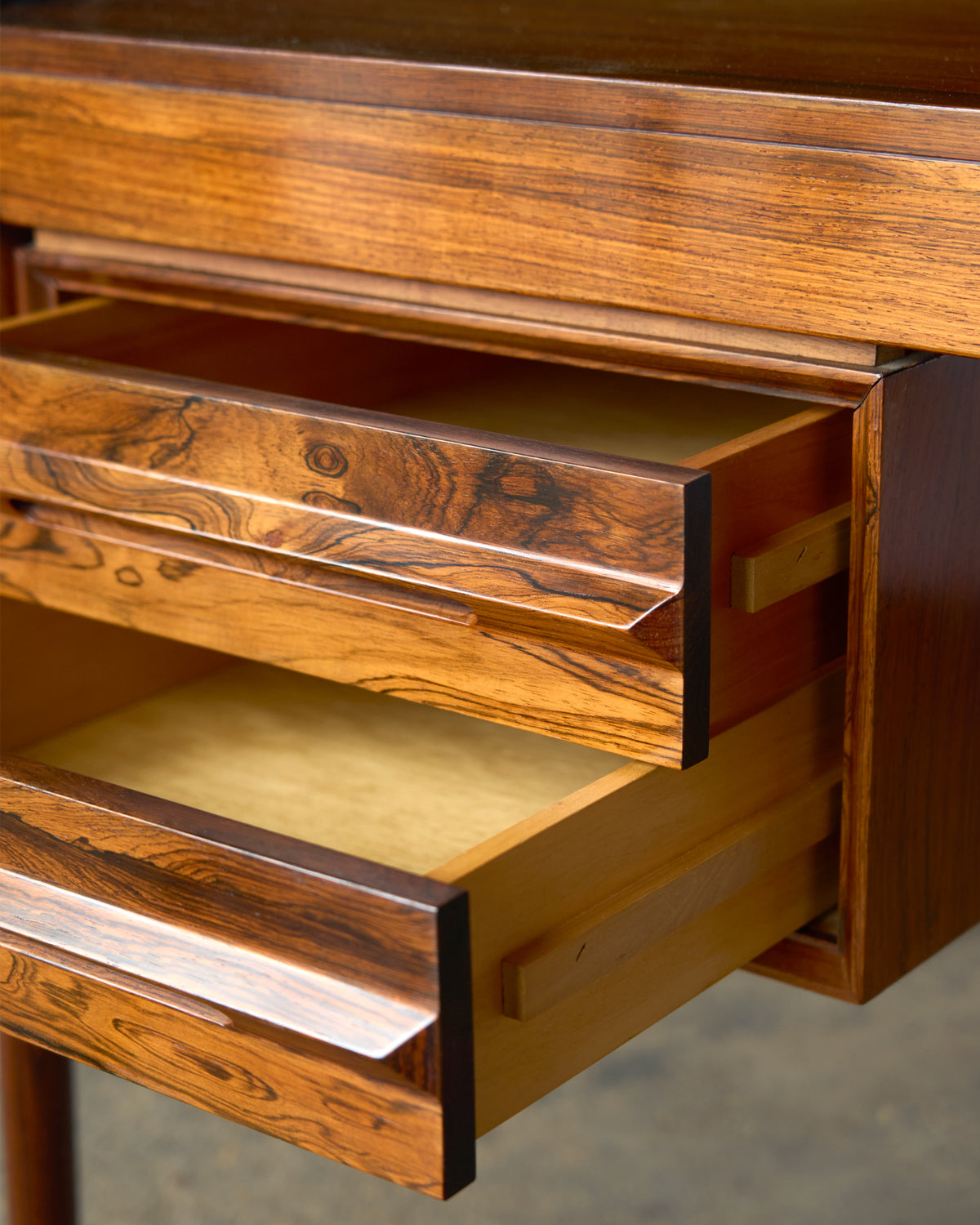 A generous Italian 1970's rosewood kneehole desk