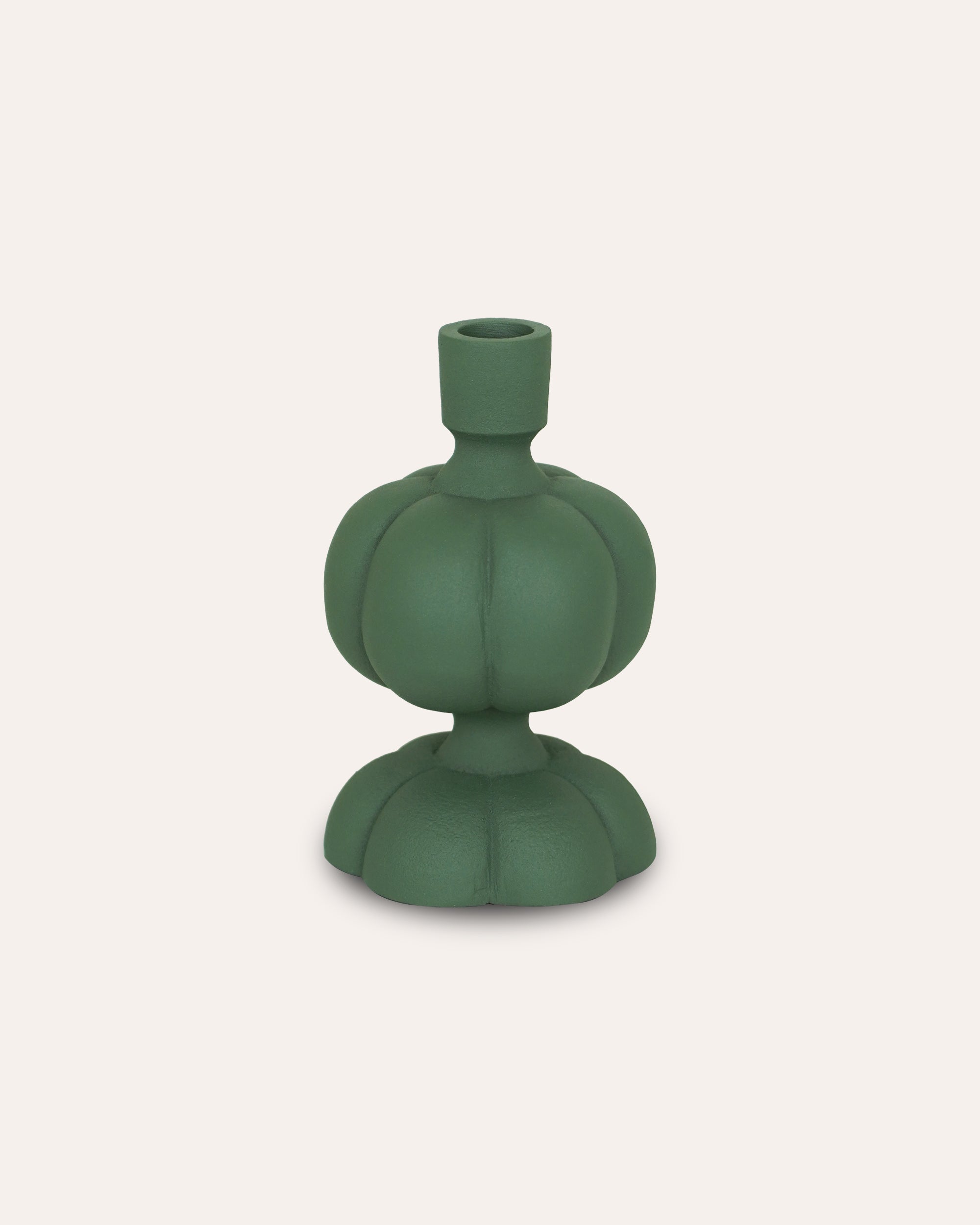 Green ceramic candle holder on a white background