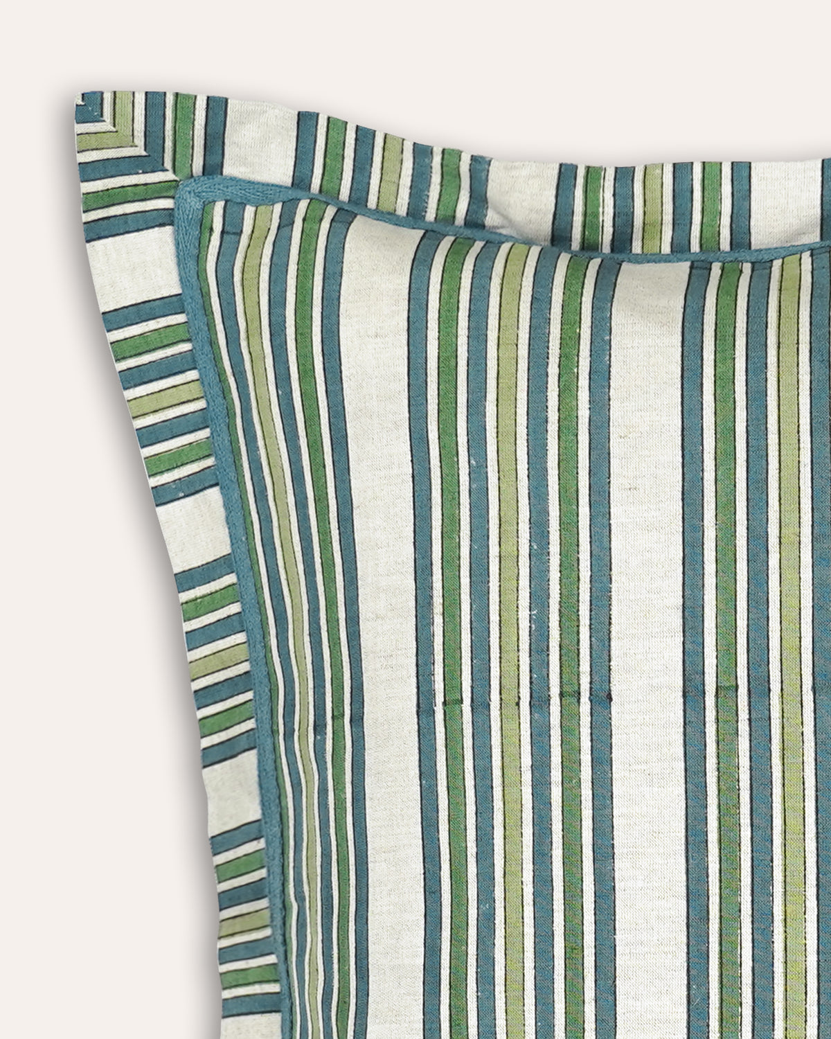 A close-up of a striped cushion, featuring vertical stripes in teal blue, sage green, olive, and cream on a light fabric background.