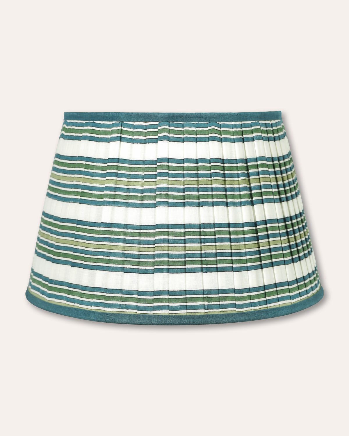 A pleated lampshade with horizontal stripes in teal green, olive green, and white, featuring a solid teal waistband and hem, shown against a light beige background.