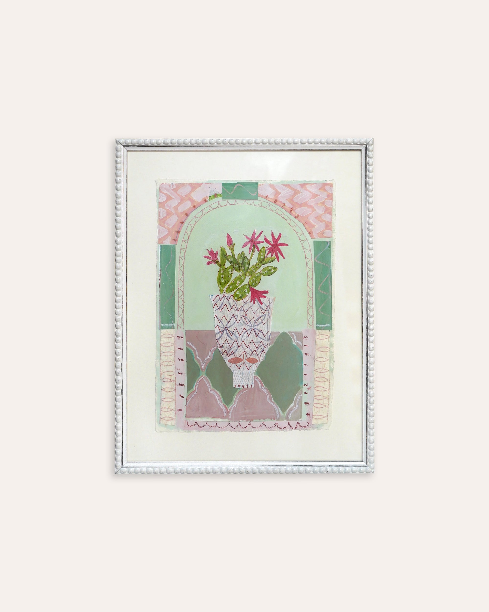 Framed artwork with a floral design on a white background