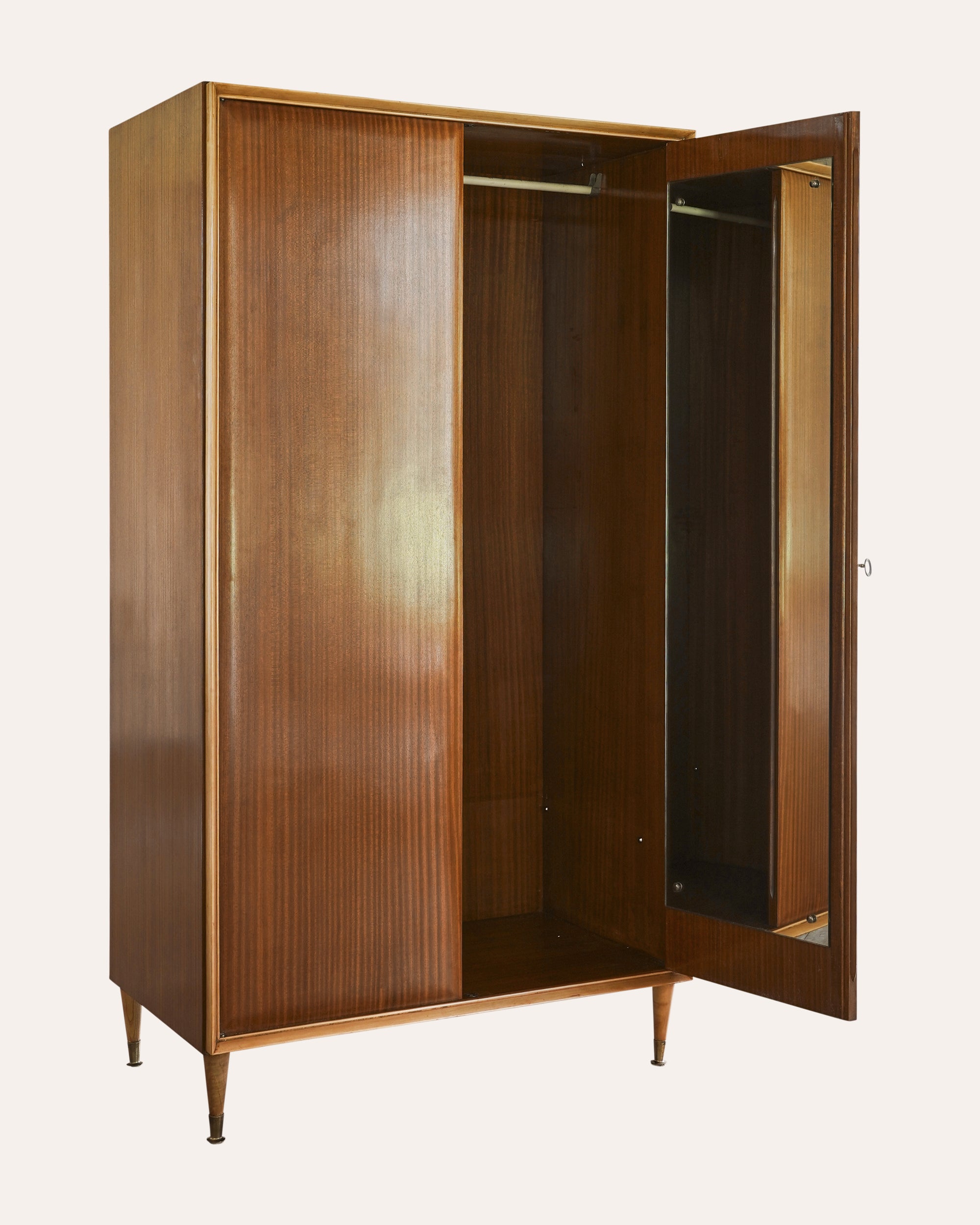 Wooden wardrobe with open doors on a white background