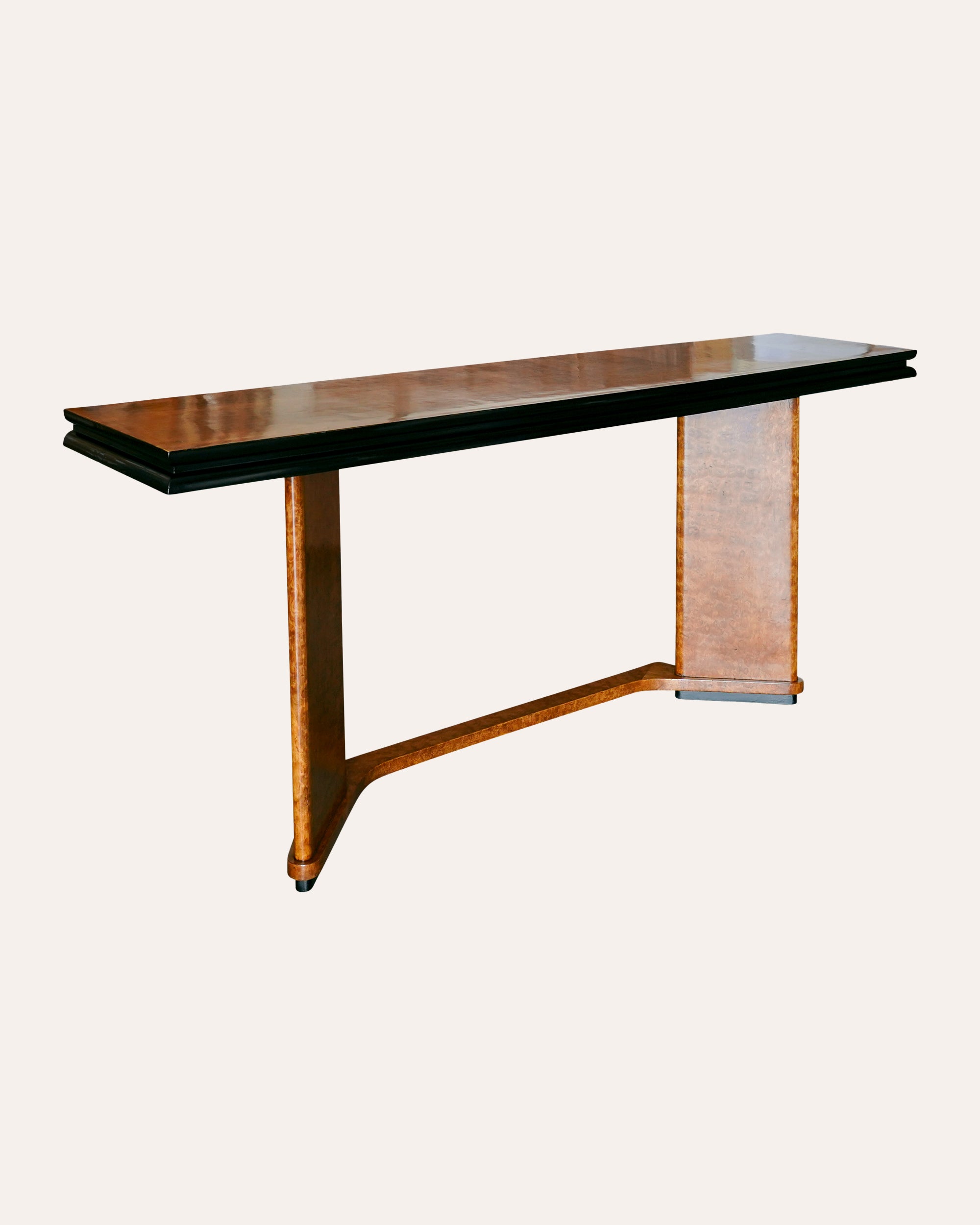 Wooden console table with a black top on a white background