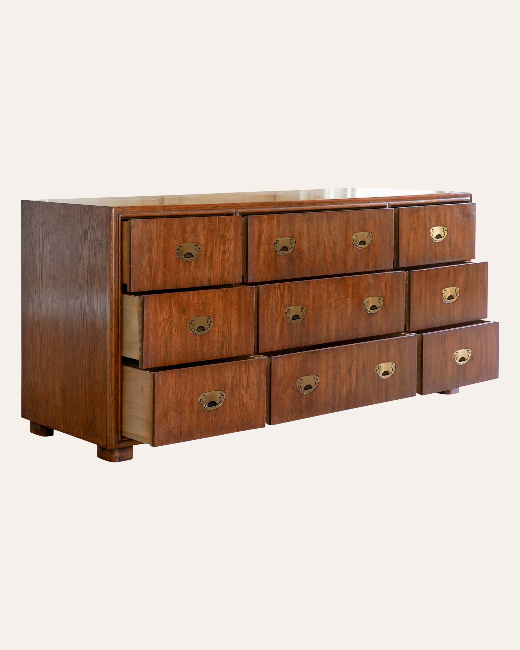 Wooden dresser with multiple drawers on a white background
