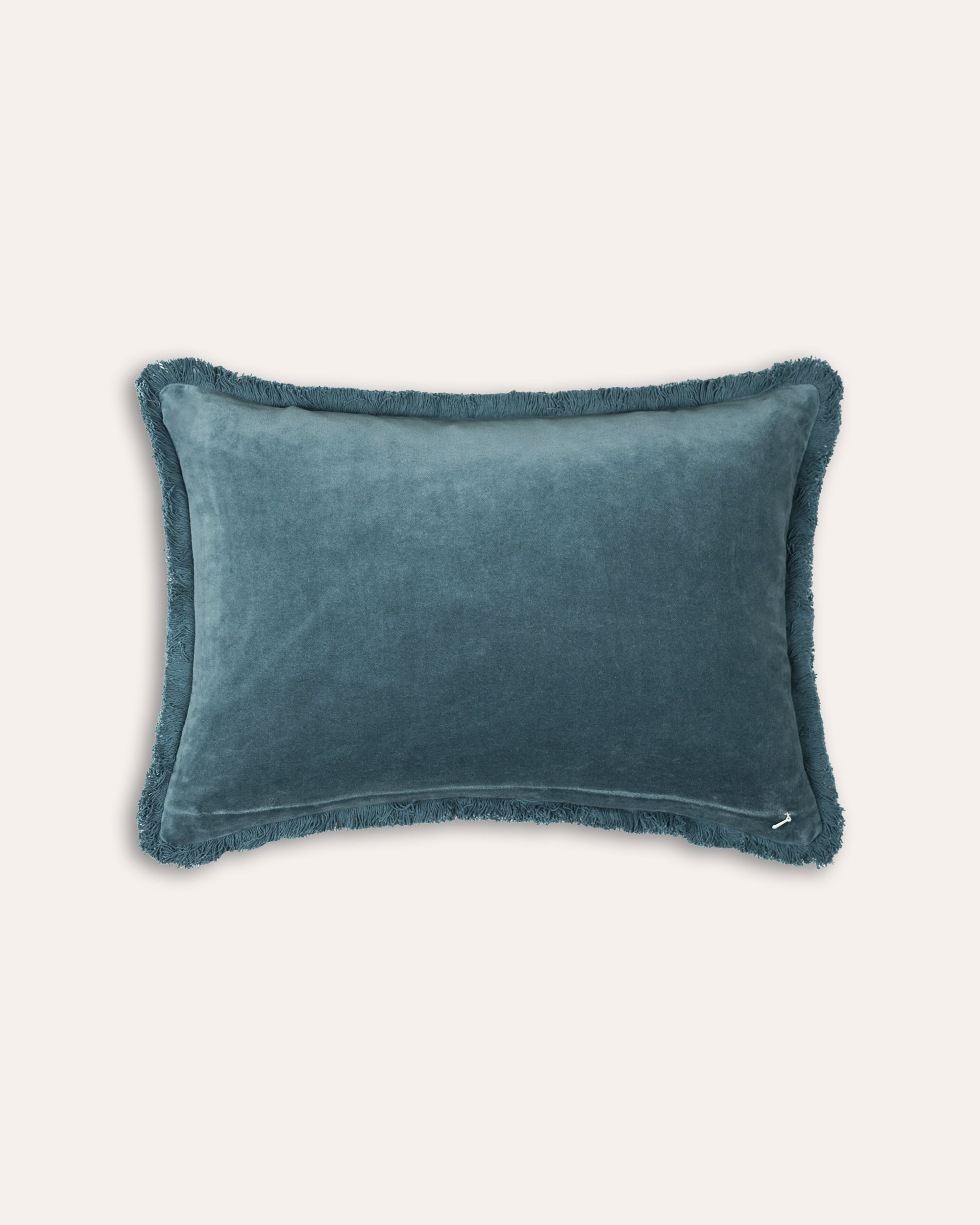 Blue textured pillow on a white background