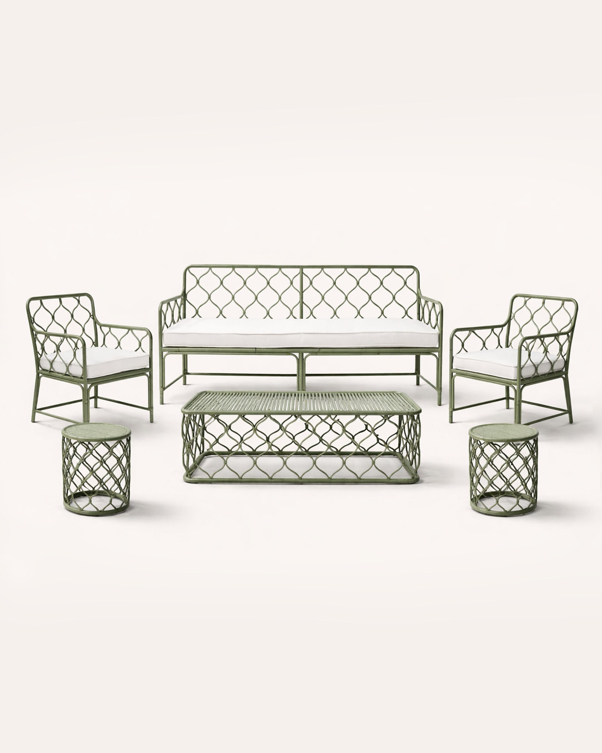 Outdoor furniture set with a sofa, two chairs, and two side tables on a white background