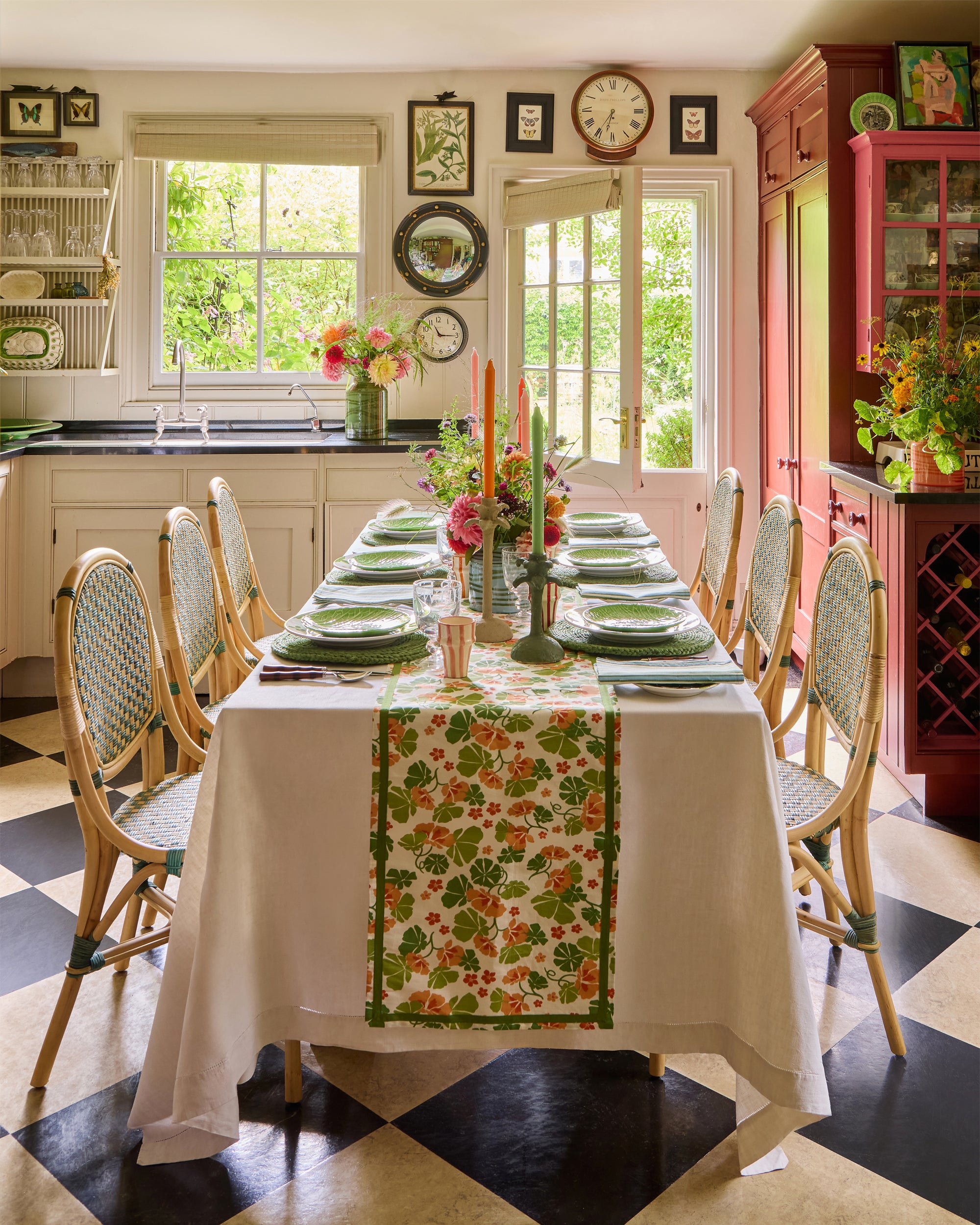 Summer floral tablescape featuring orange and green table linens from the Nasturtium collection