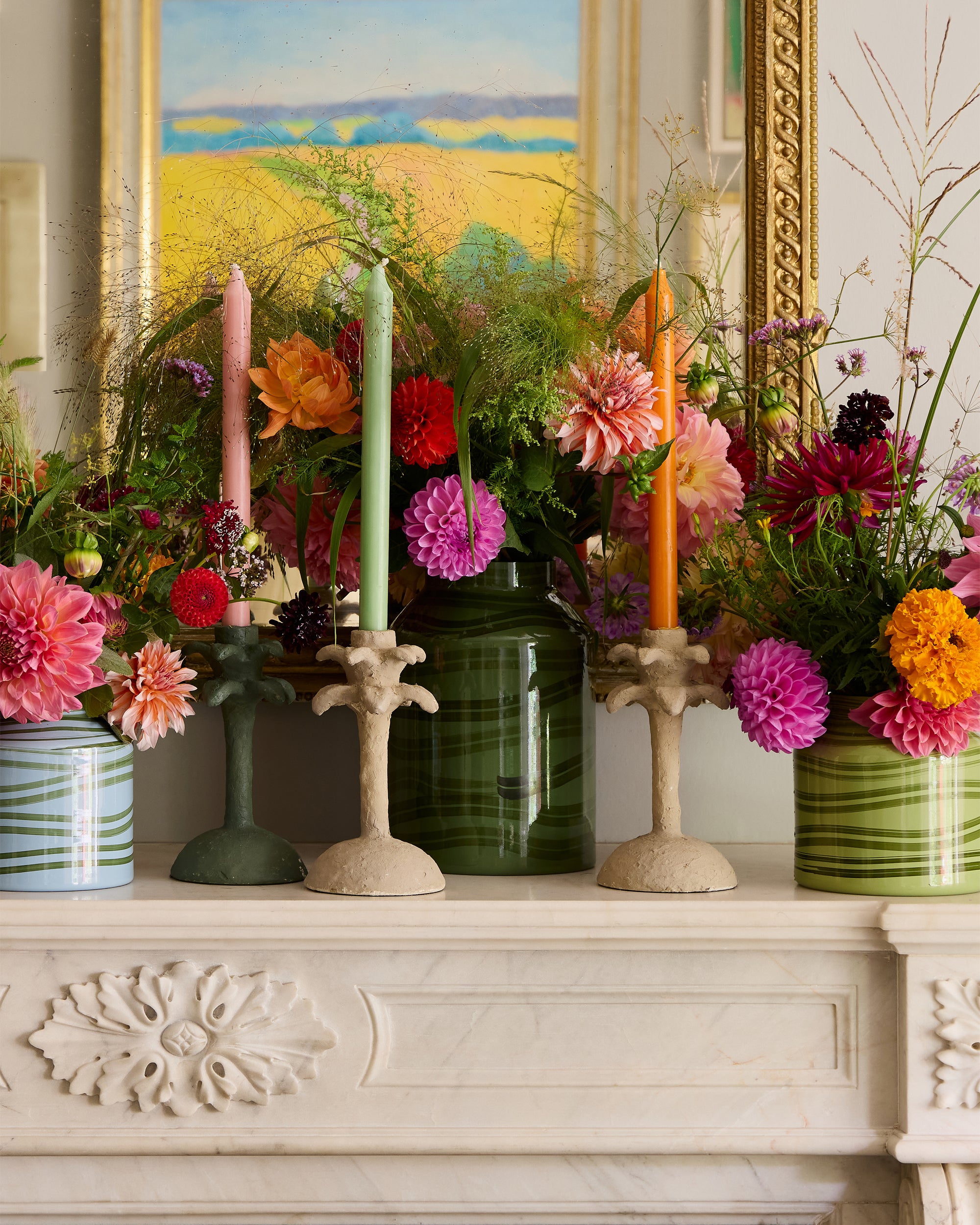 Fireplace styled with Summer flowers in the Maypole vases, styled next the the Palm leaf candlesticks from the Nasturtium collection