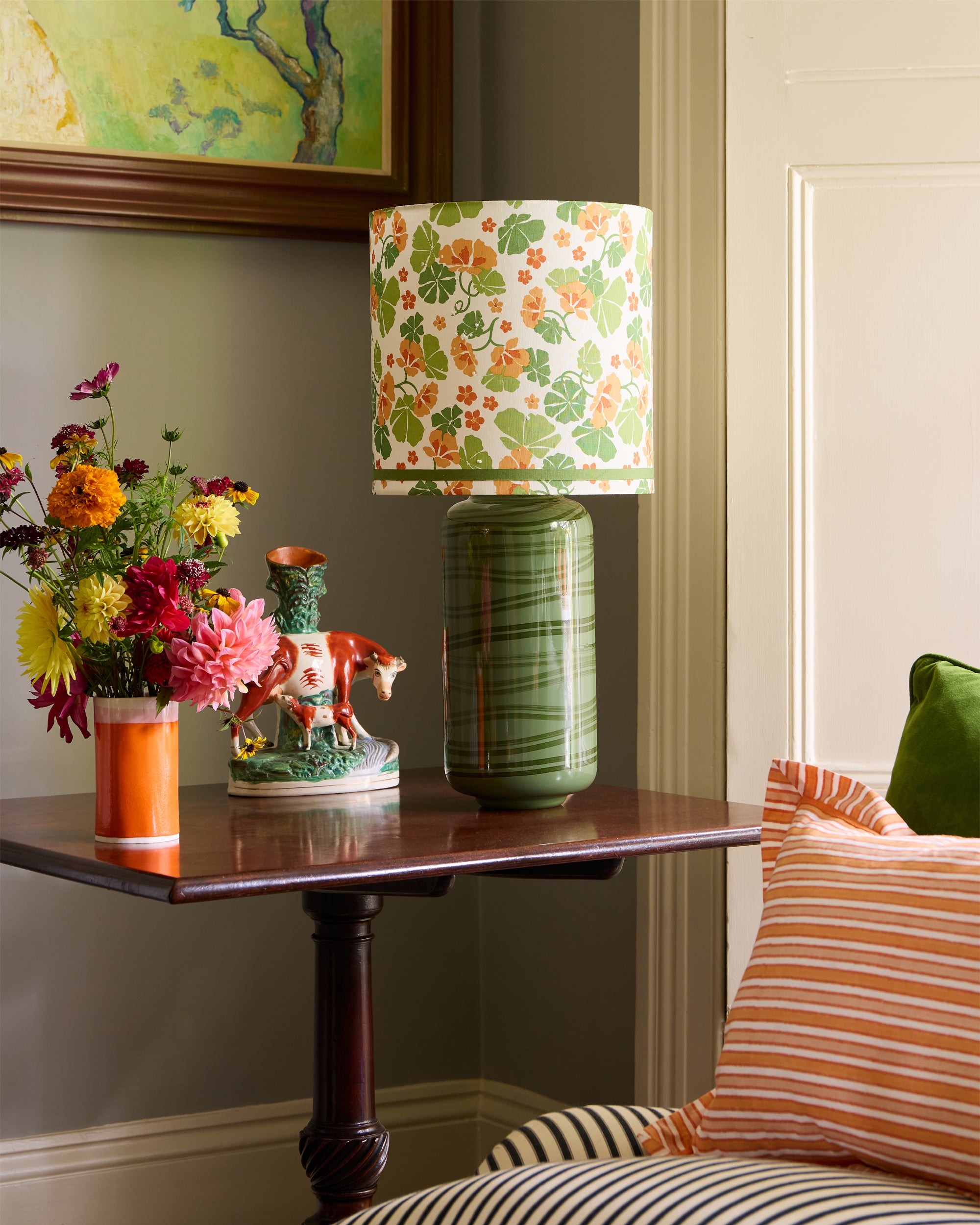 The Nasturtium drum shade styled on the maypole green lamp base