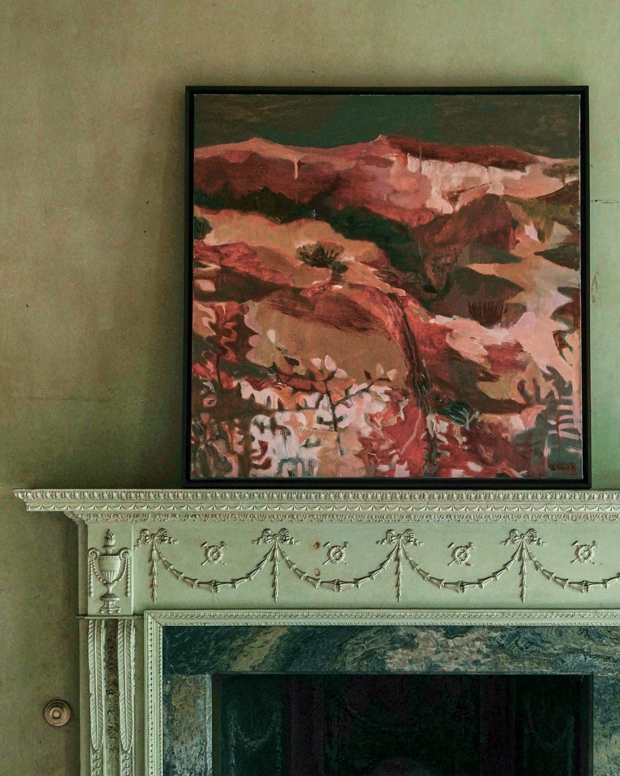 Abstract painting on a wall above a decorative fireplace.