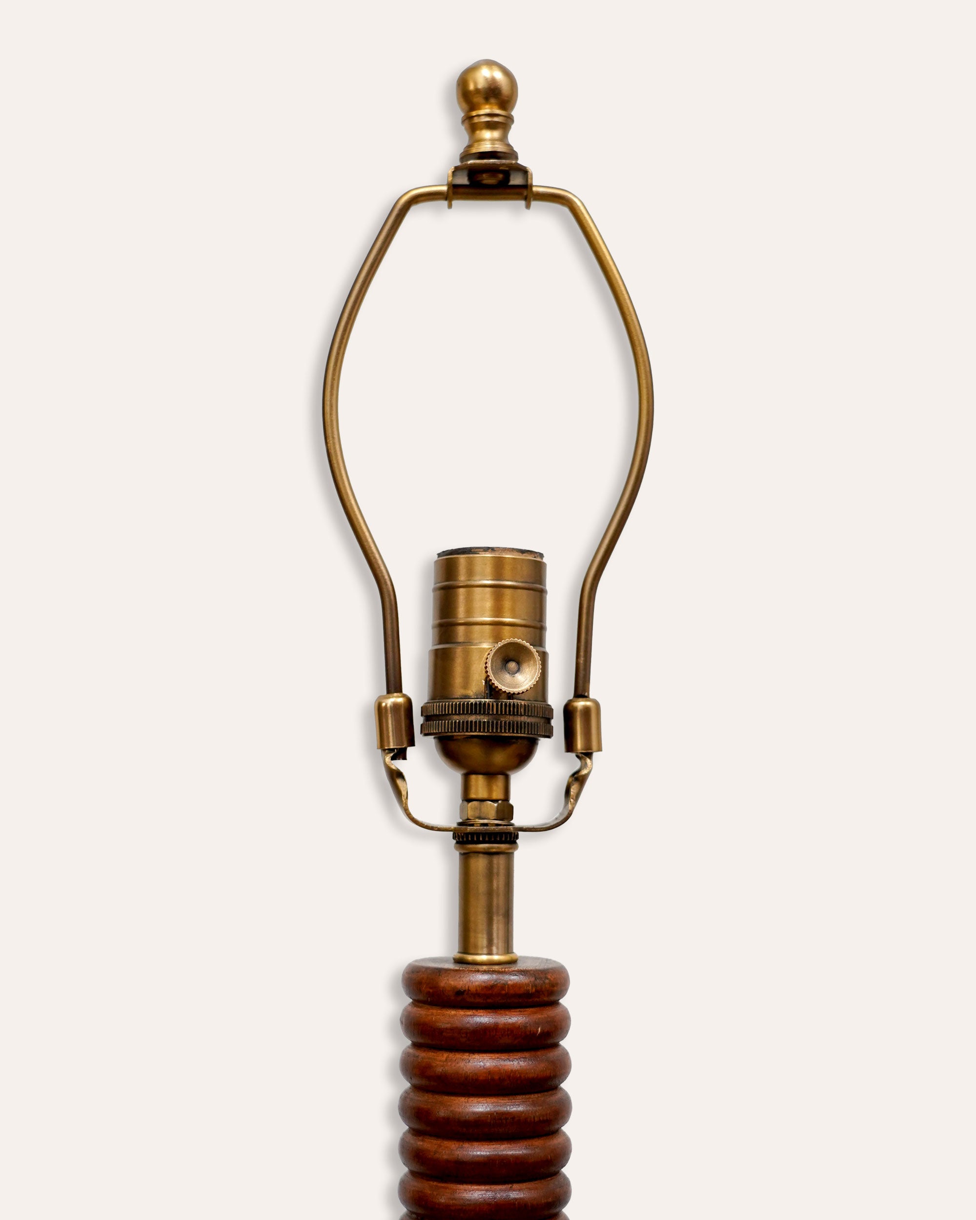 US brass light fitting on a wooden floor lamp