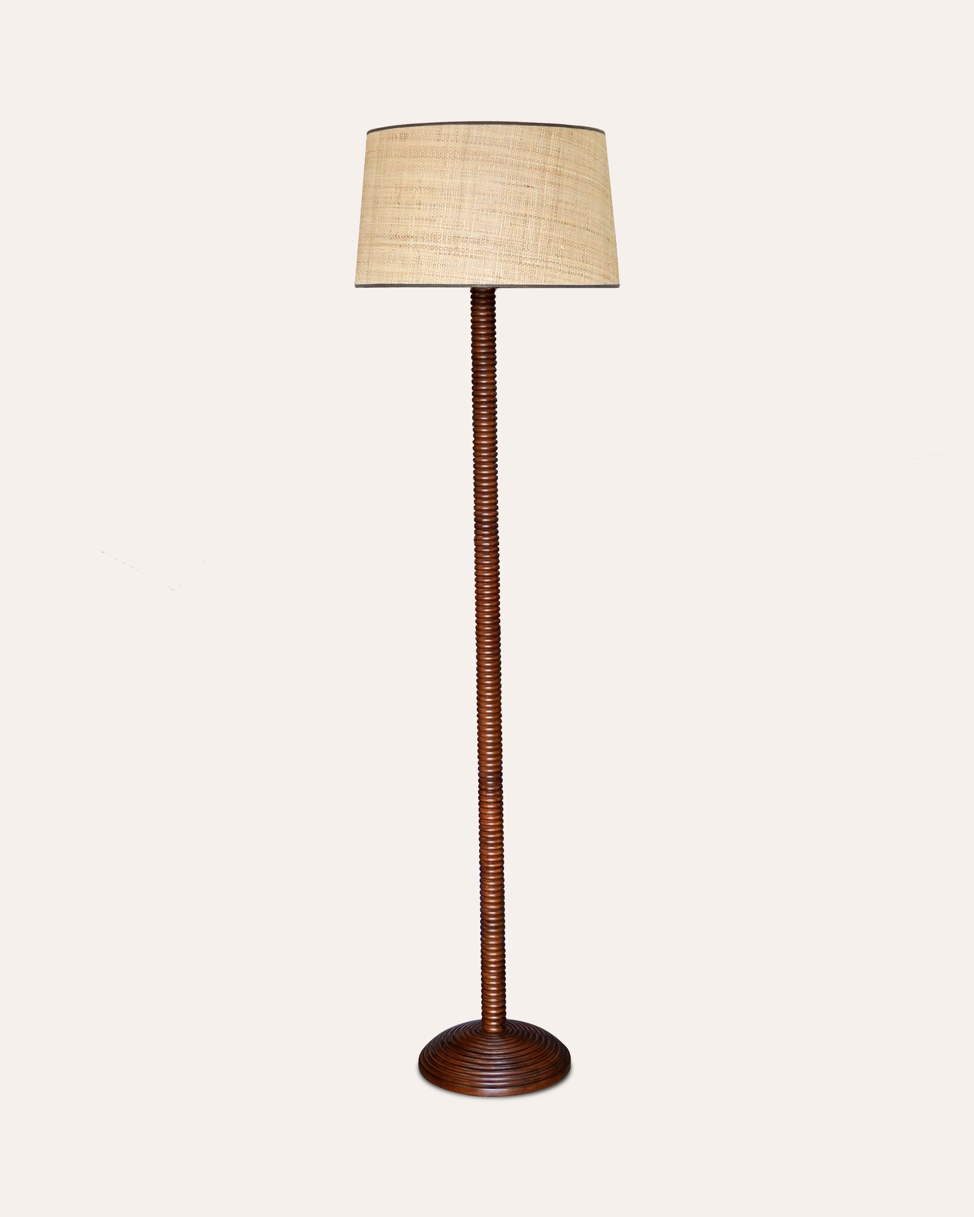 Churidar Floor lamp with a woven Seema Raffia shade on a white background