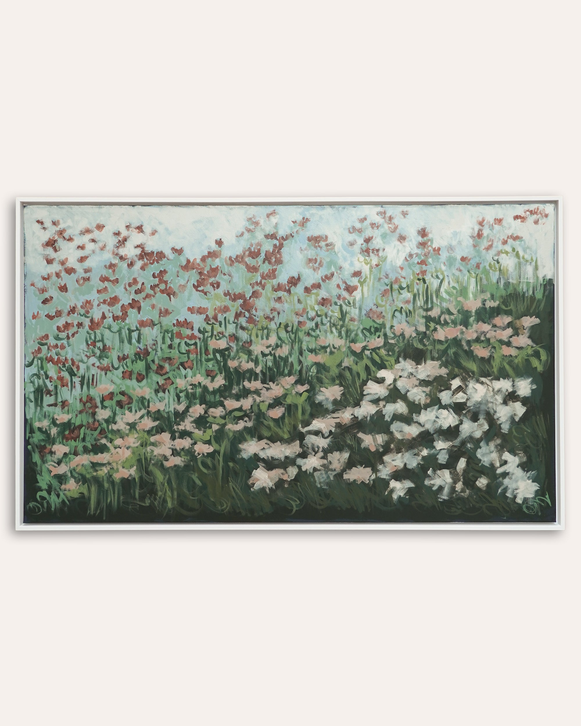 Framed artwork of a floral landscape with red, pink, and white flowers on a light gray background.