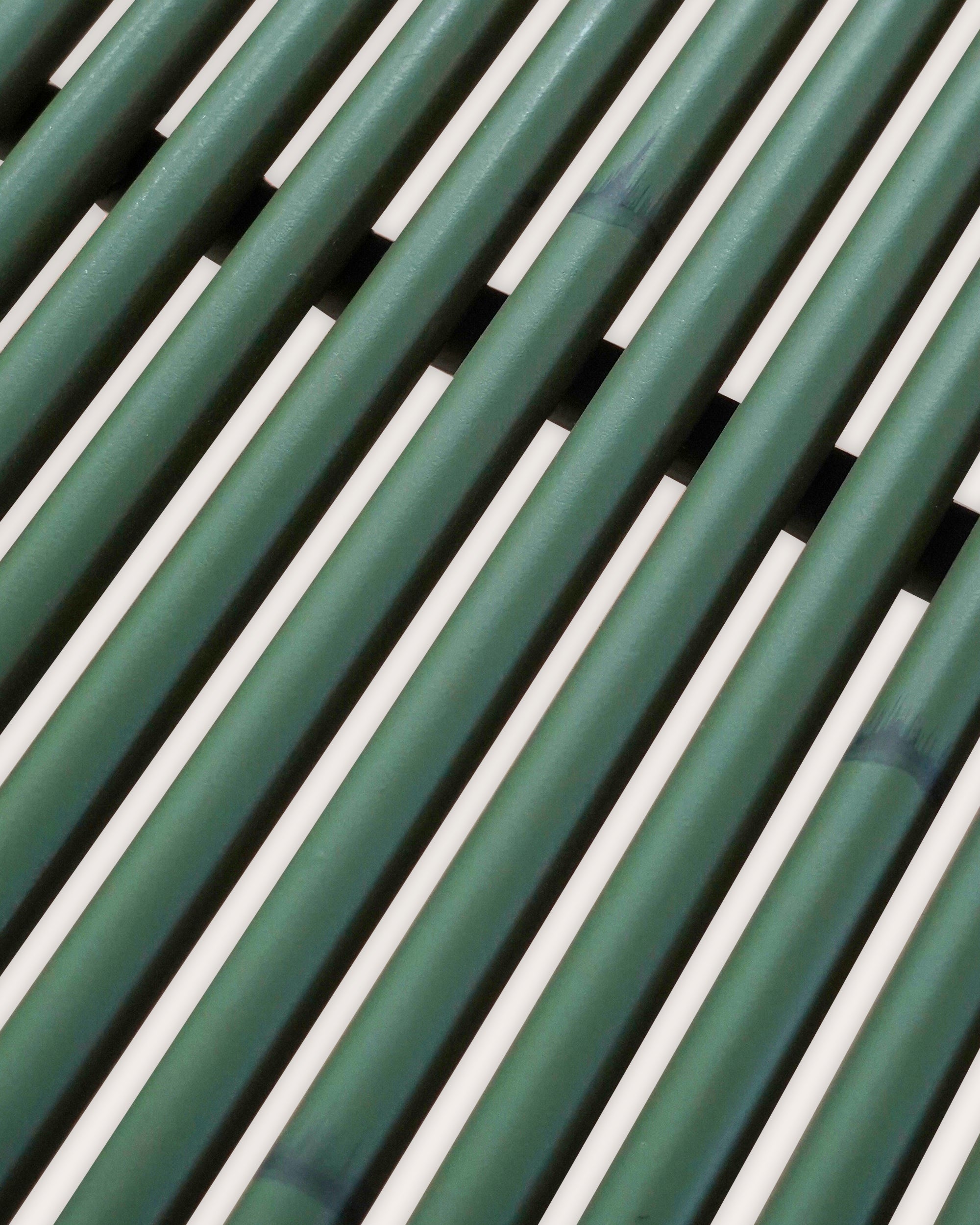 Close-up detail image of the green Curato dining table