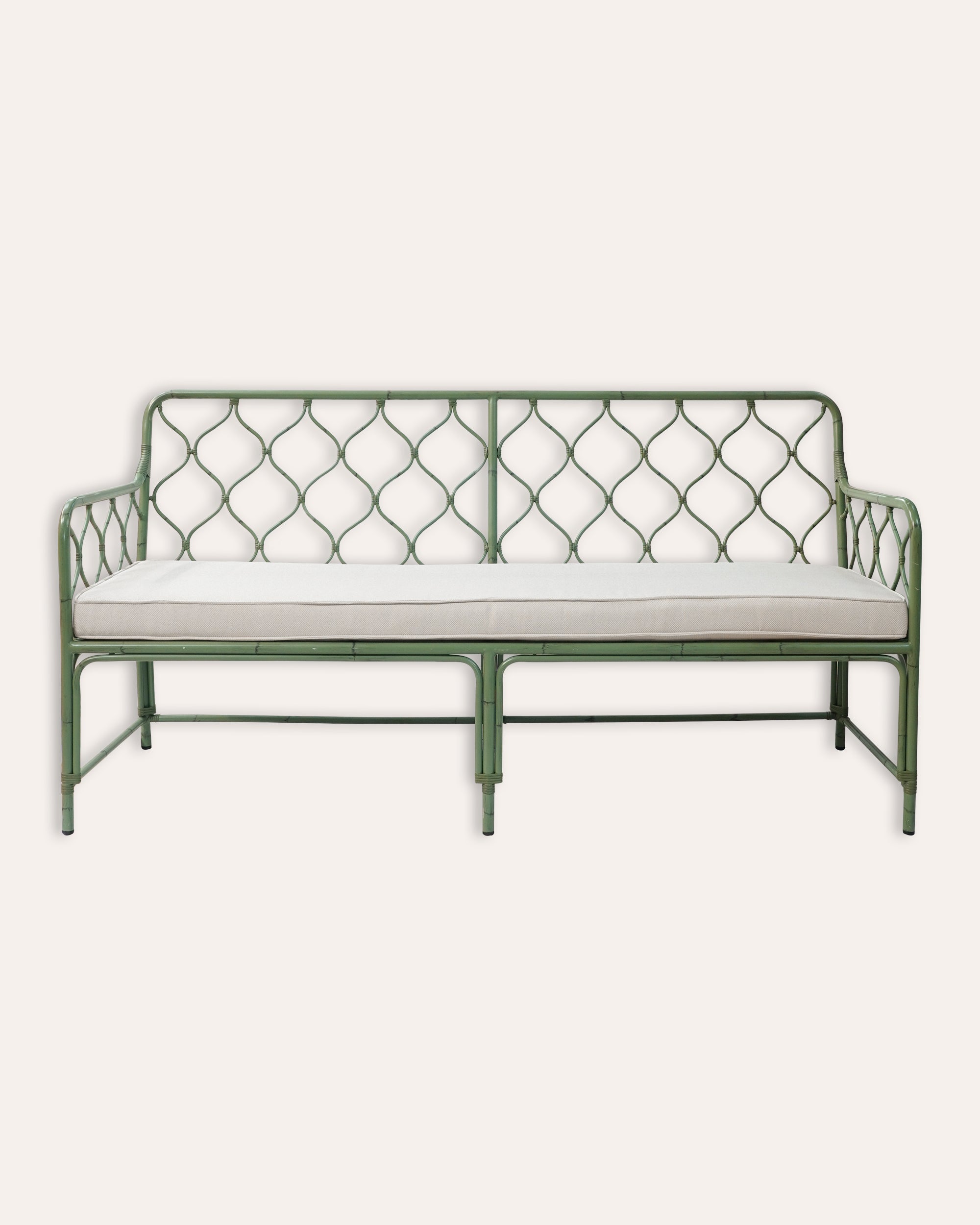 A green Curato Garden Sofa with a metal frame and a white cushion.
