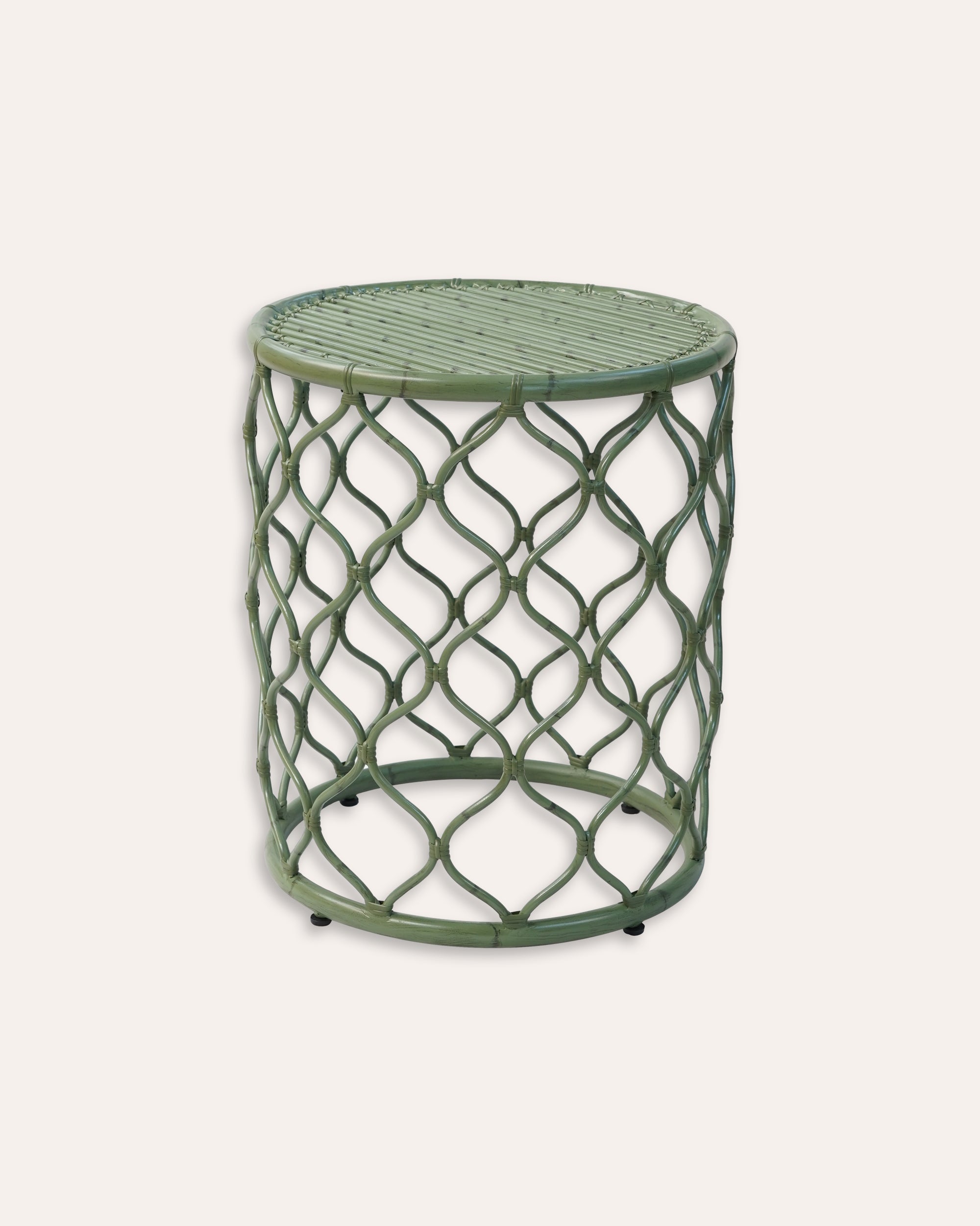 A green hand-crafted aluminium garden side table with a geometric patterned frame.