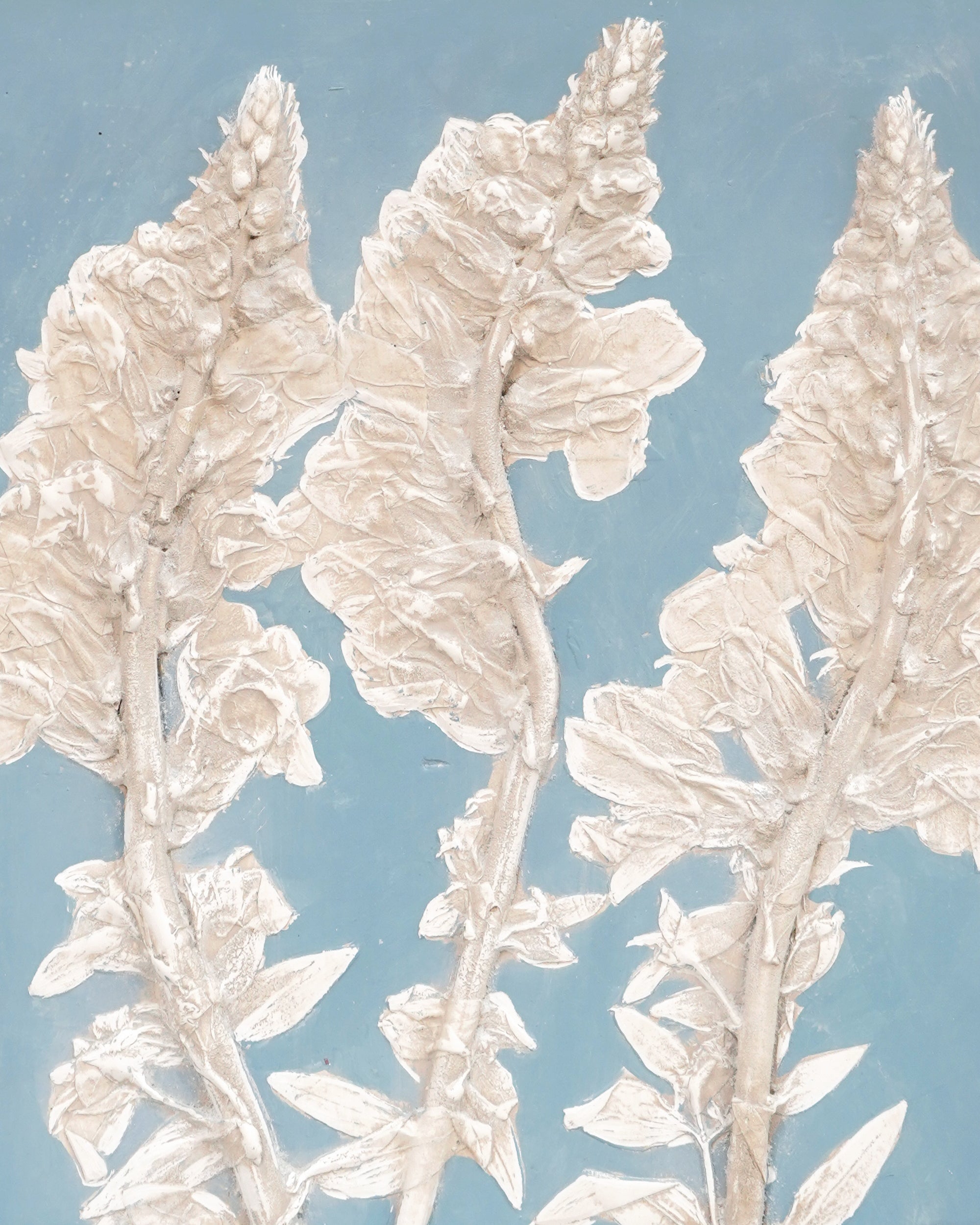 Decorative white floral design on a light blue background