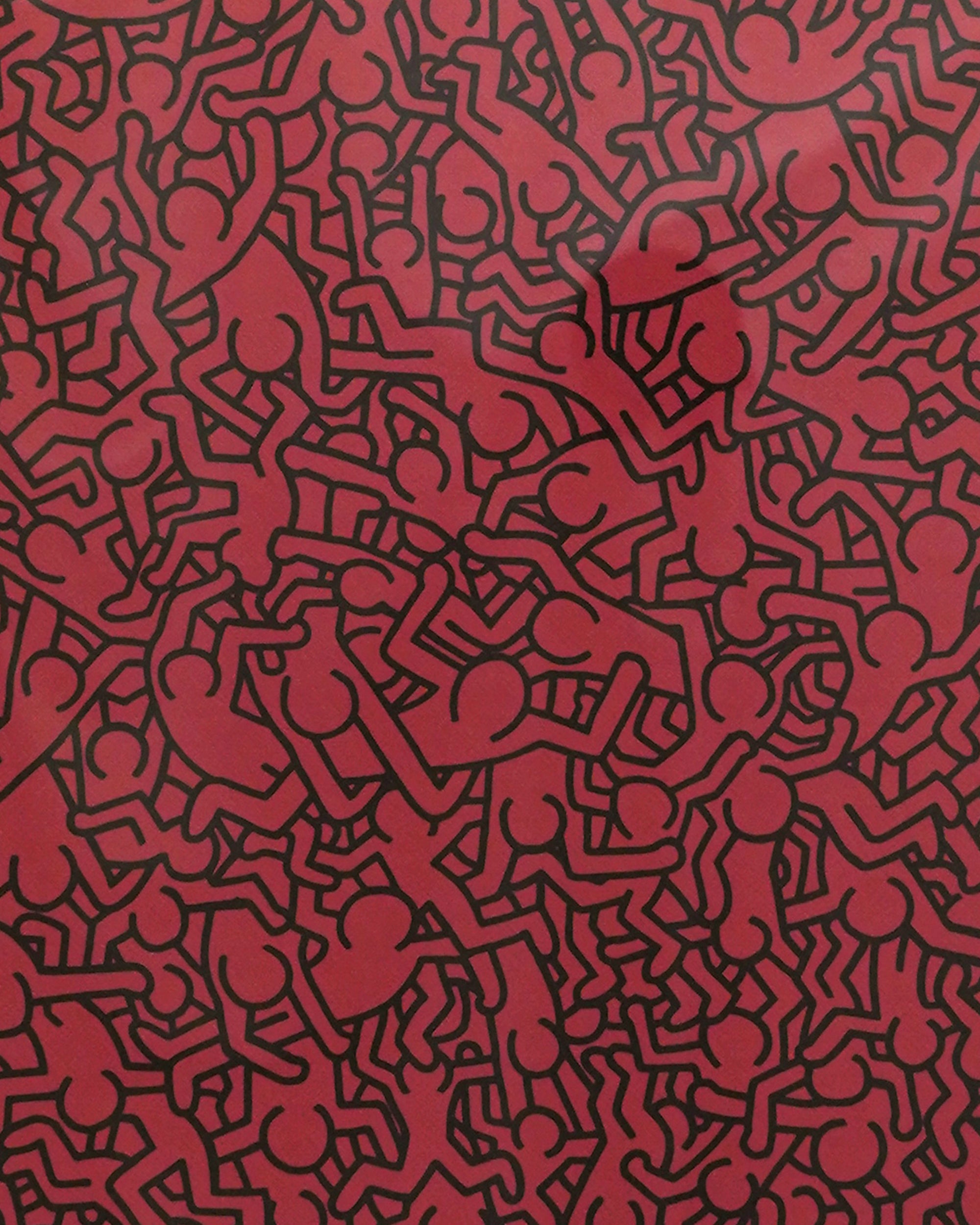 Pattern of red stick figures on a red background