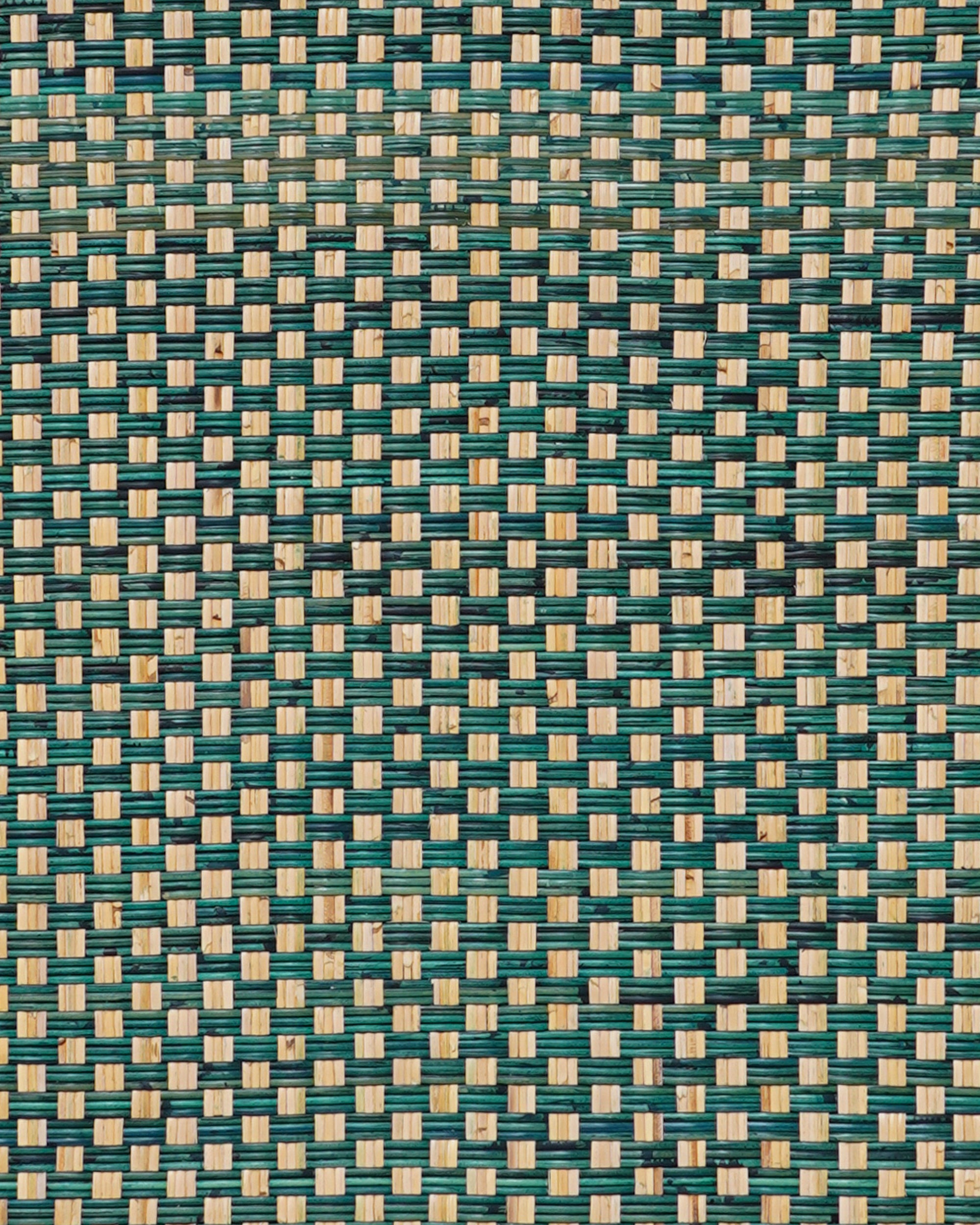 Close up detail of the woven pattern with green and beige colours on the rattan king headboard