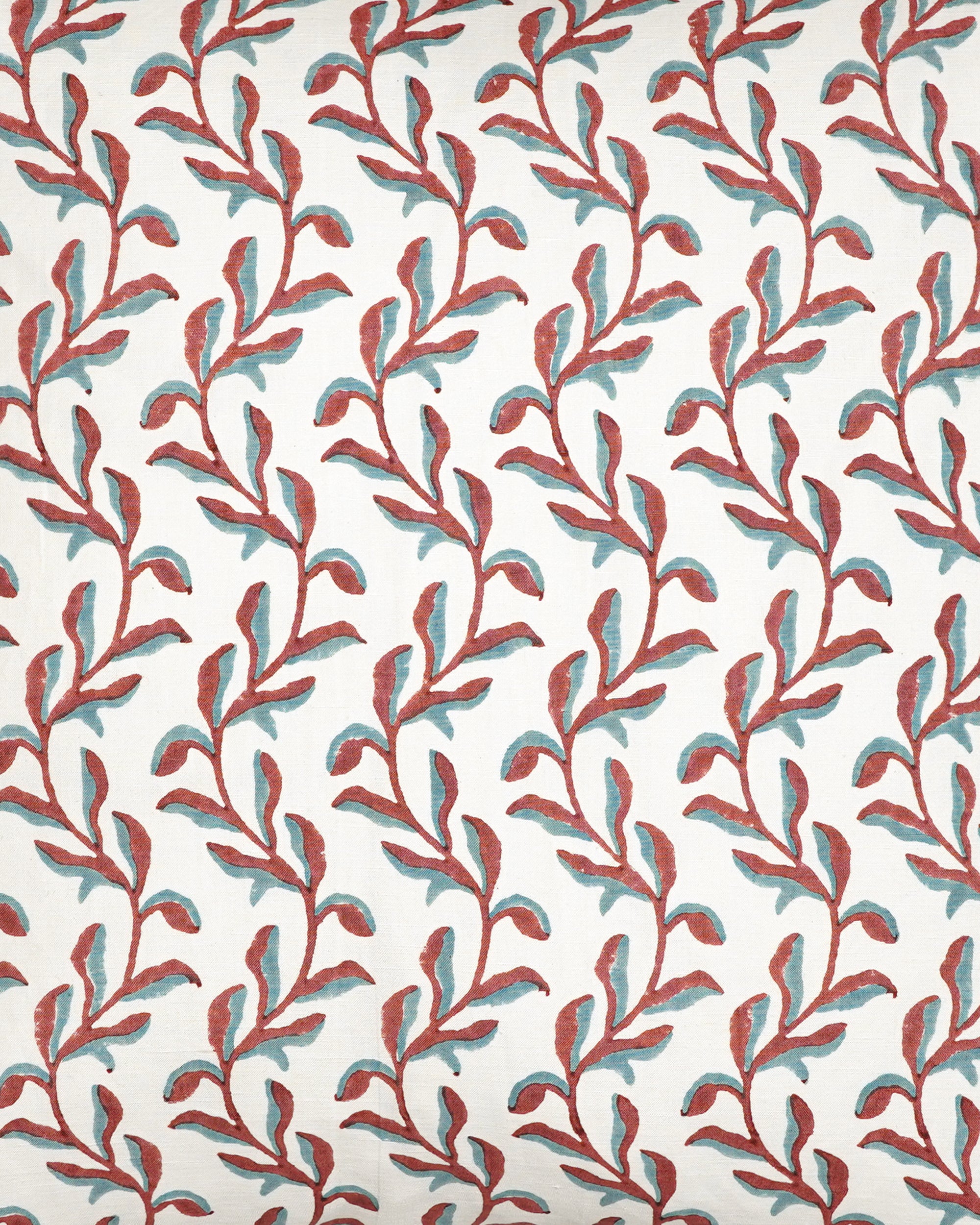 Close up detail image of the square blue and red Mariana floral print cushion