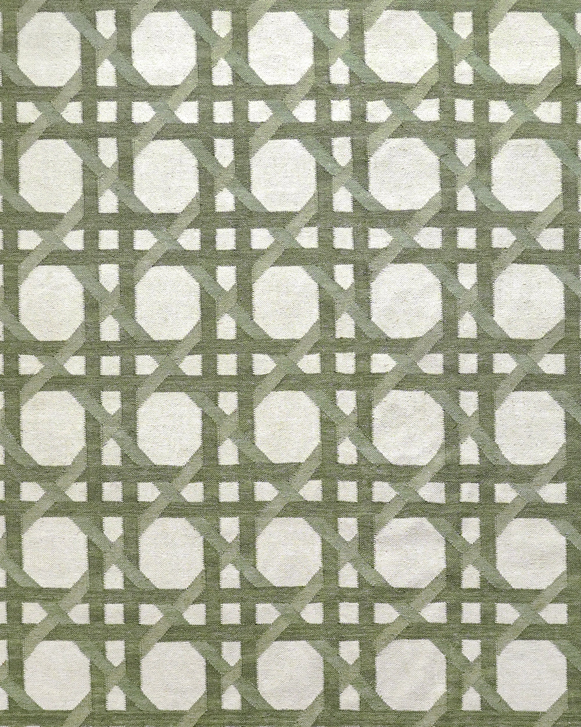 Close up detail of the Ganna flat weave green rug with a geometric pattern