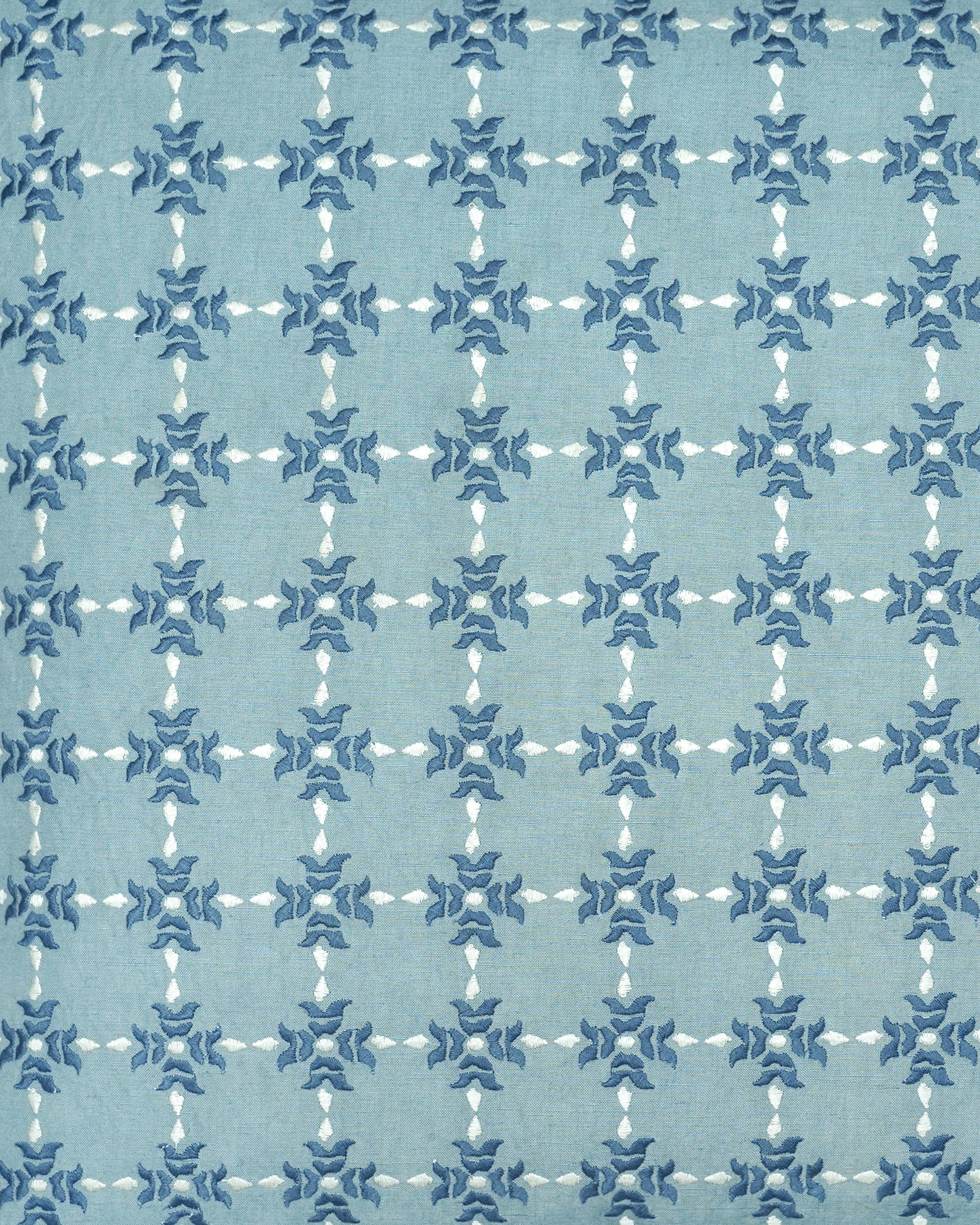 Close up detail of the blue and white Khiva embroidered square cushion with a geometric pattern