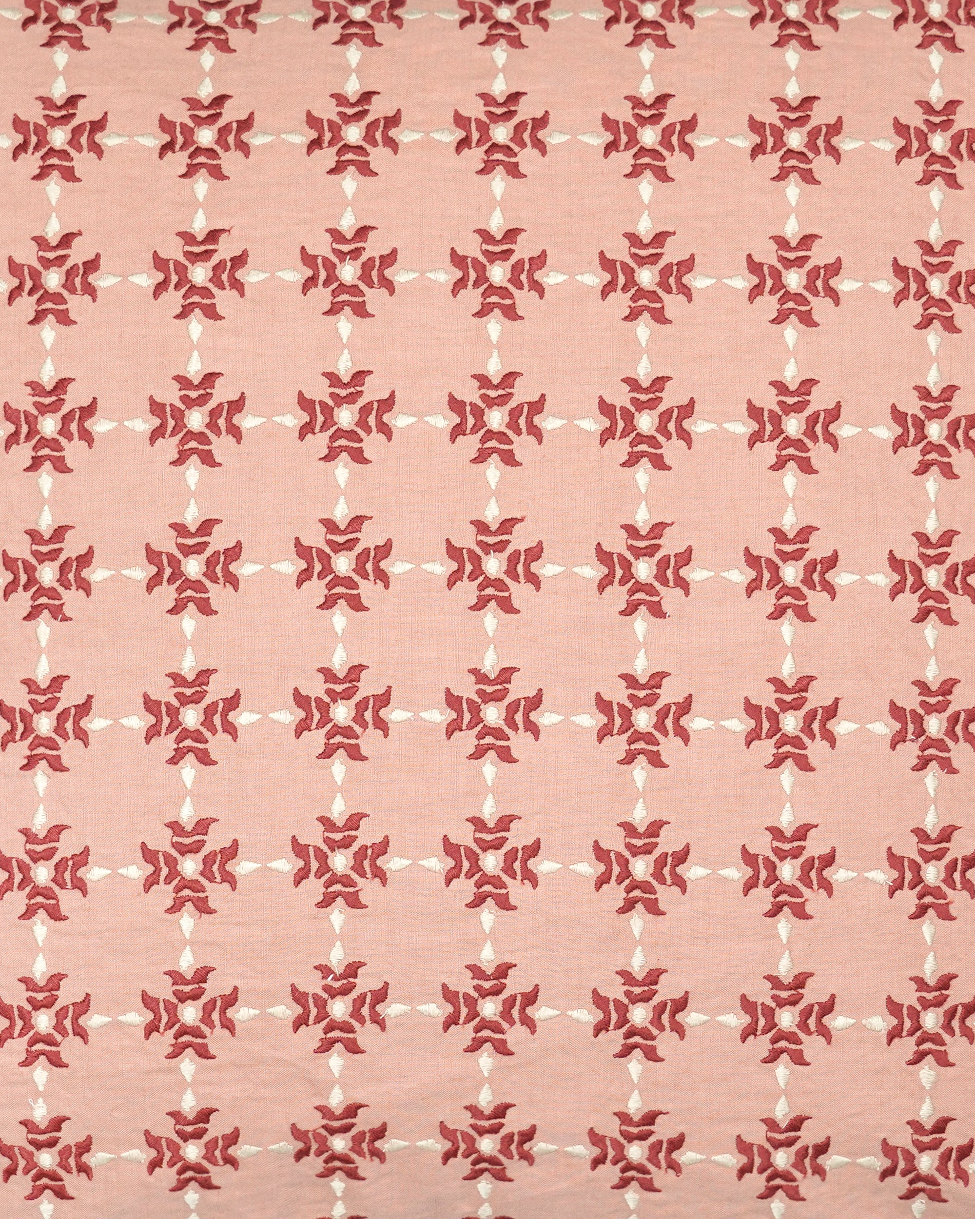 Close up detail of the pink and red Khiva embroidered square cushion with a geometric pattern