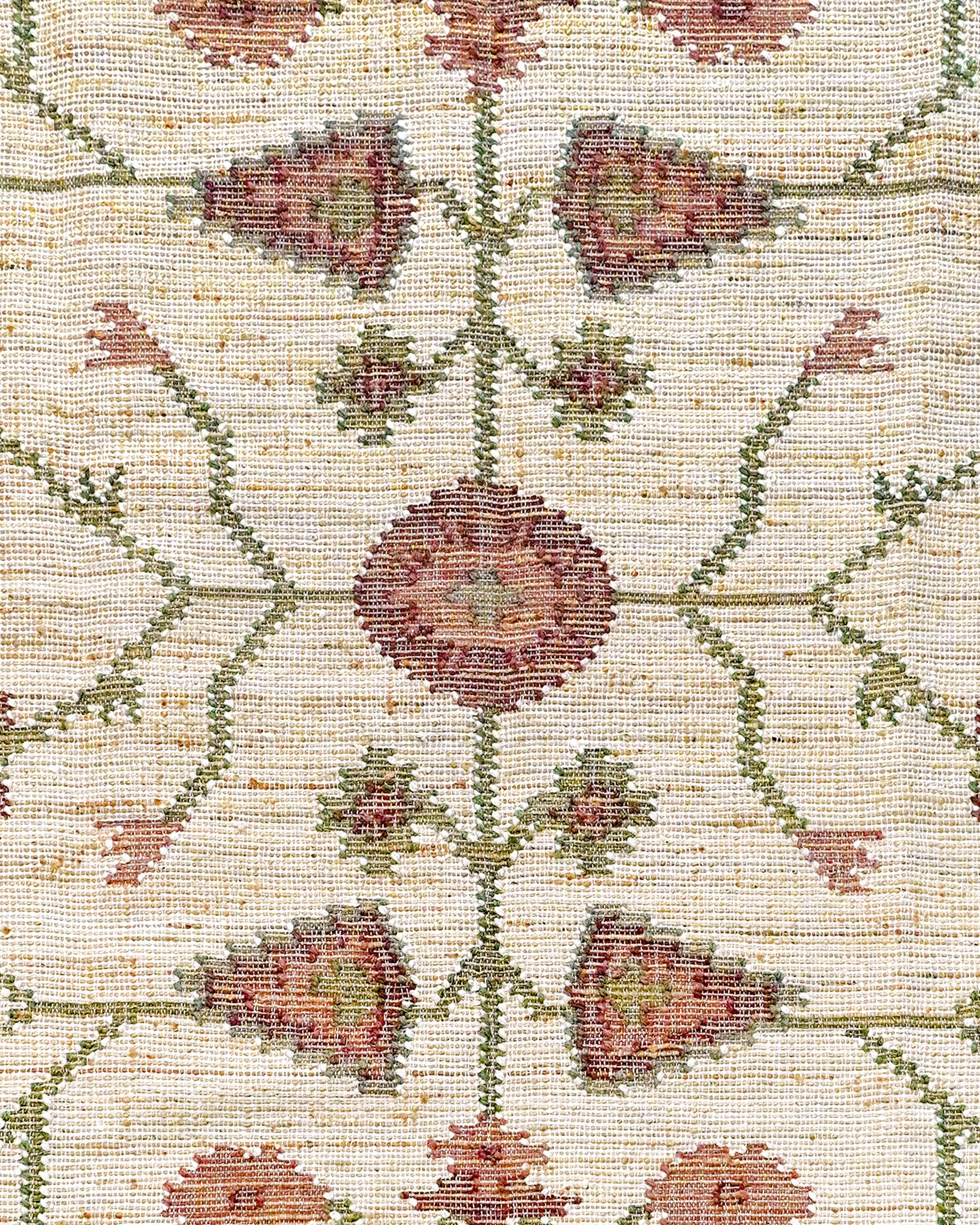 Close up detail of the pink and green floral Padma rectangular rug