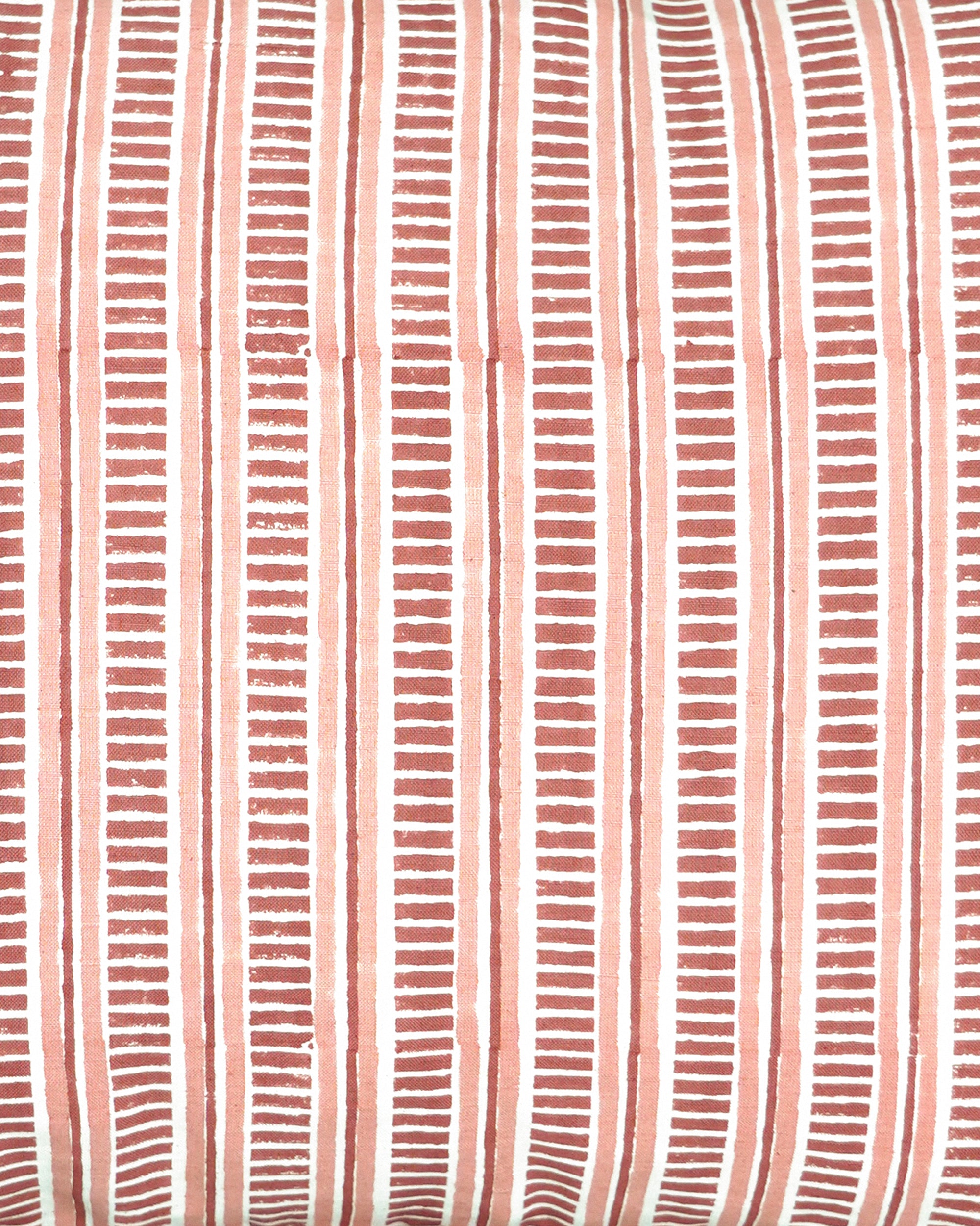 Close up detail of the pink and red Patti block printed striped rectangular cushion