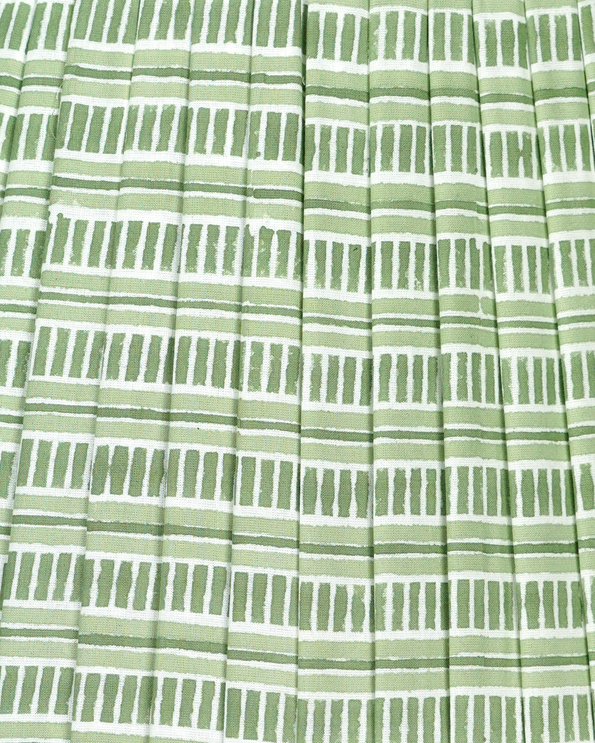 Close-up of green and white striped pleated lampshade