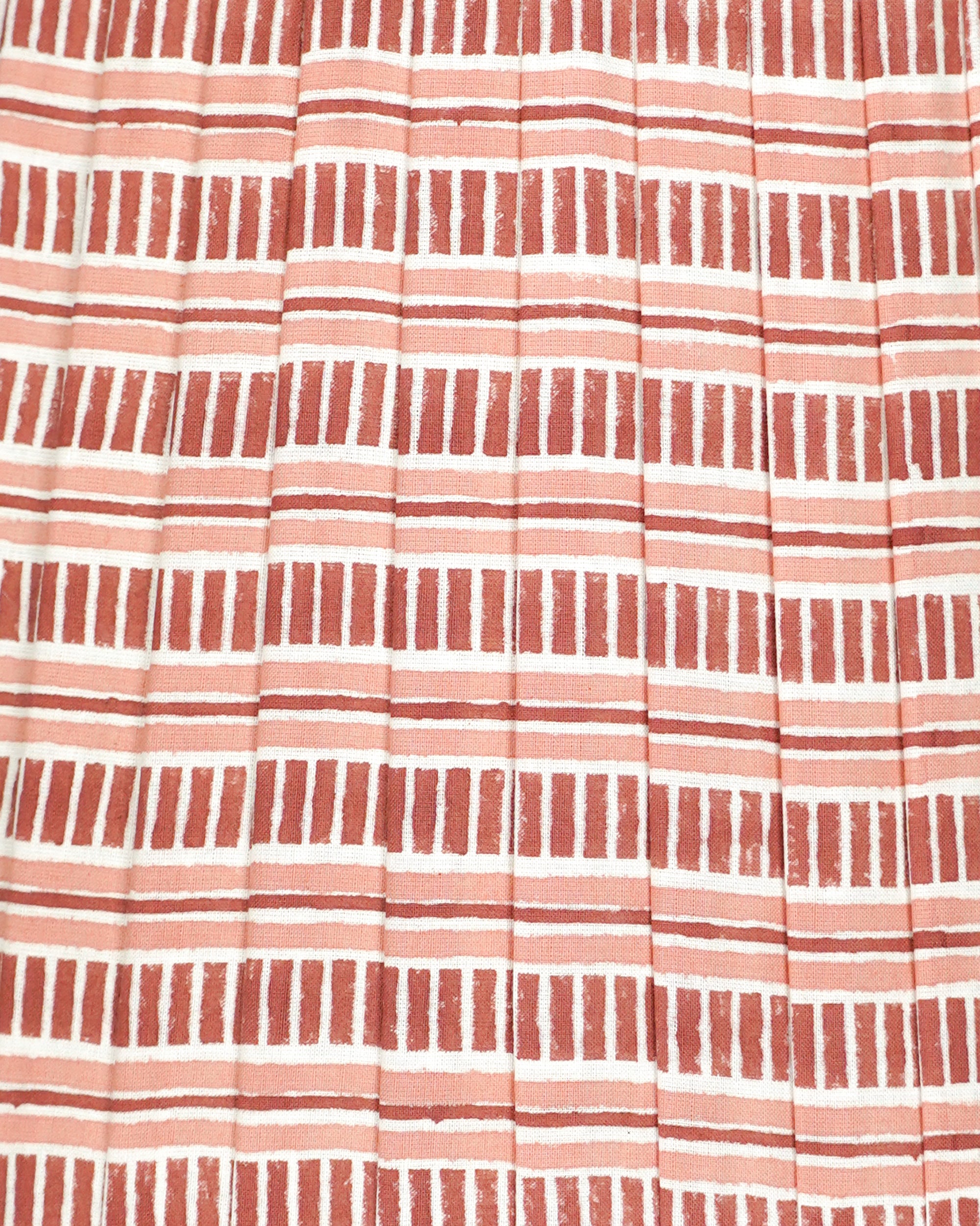 Close up detail of a red and pink pleated striped lampshade