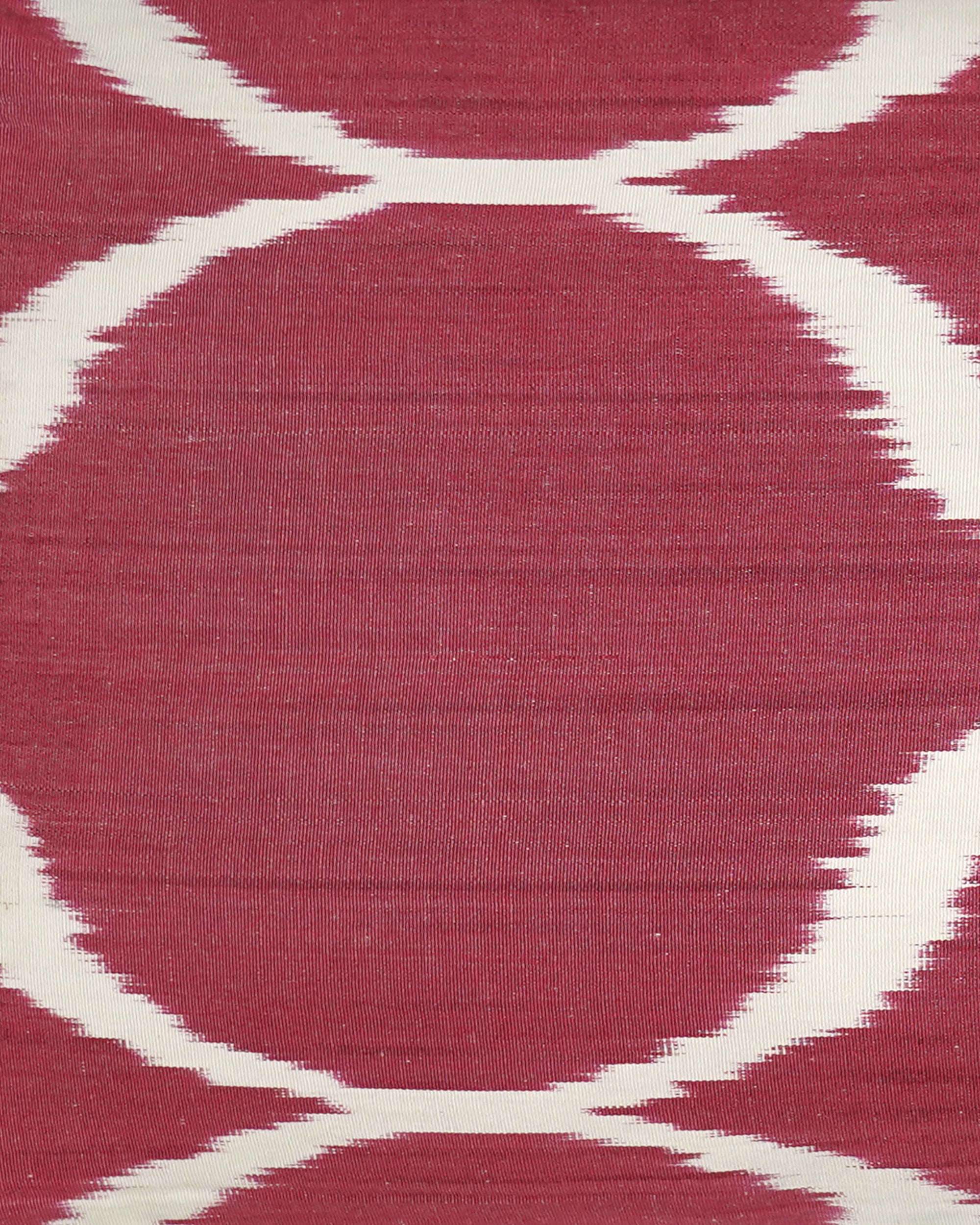 Close-up of a fabric with a red and white pattern