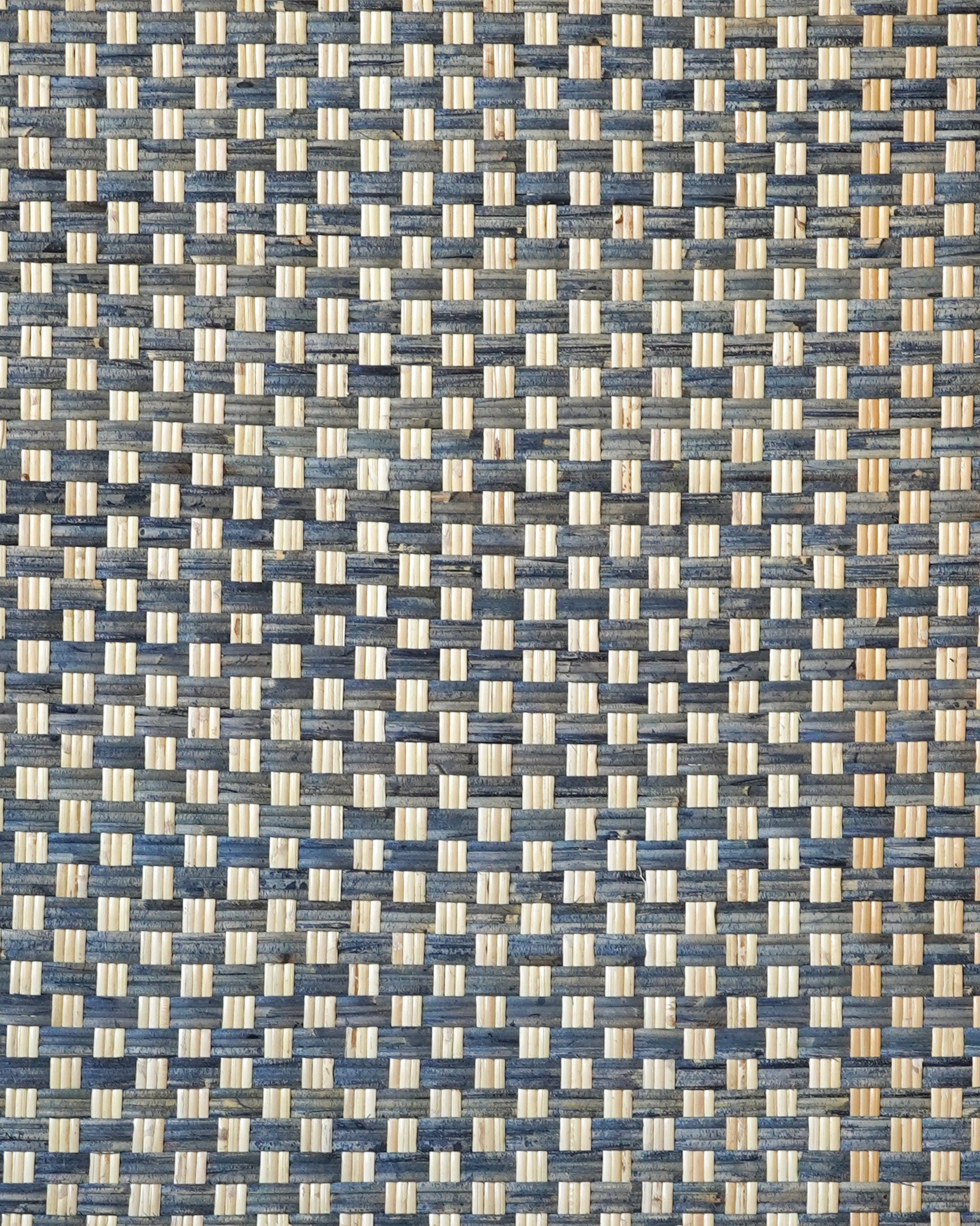 Close up detail of the woven pattern on the blue single rattan headboard
