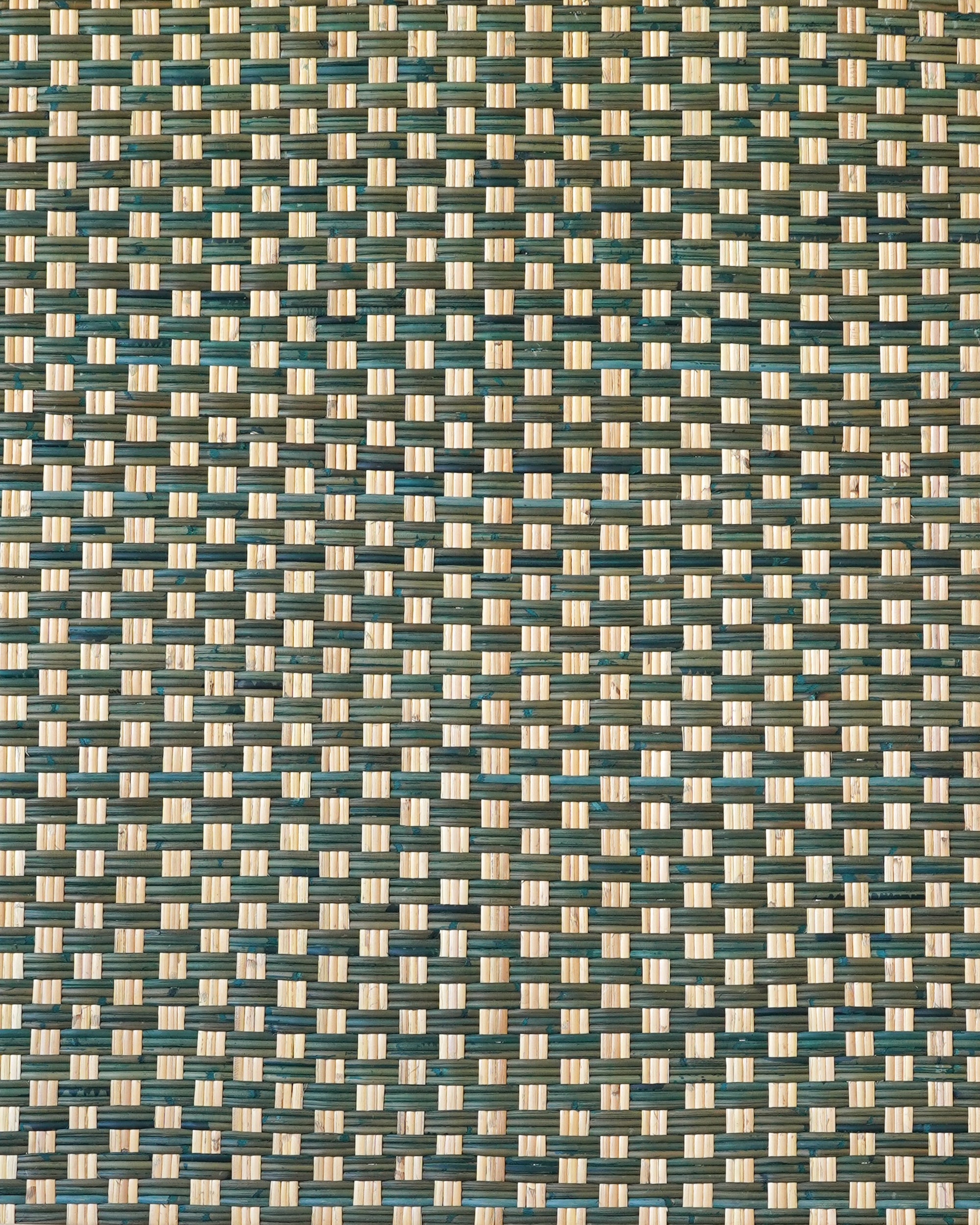 Close up detail of the woven pattern on the single rattan green headboard