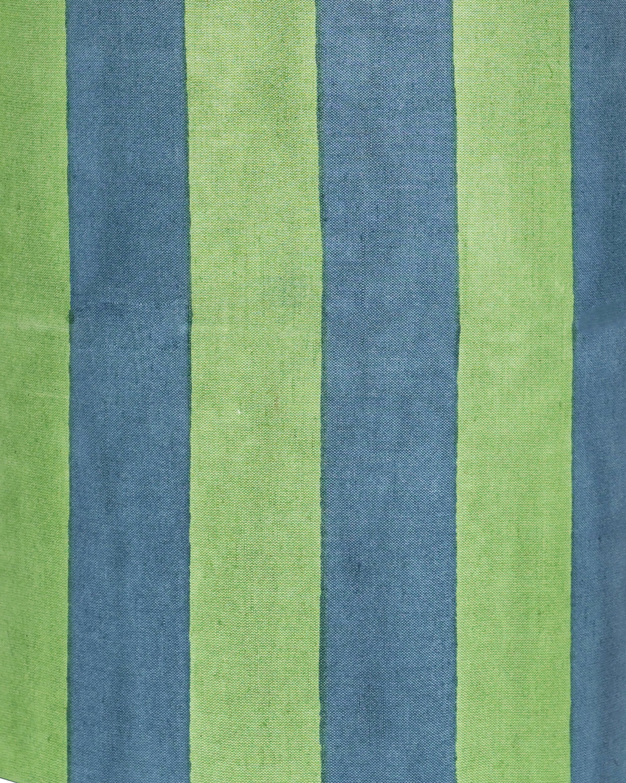 Close up detail image of the blue and green striped drum lampshade