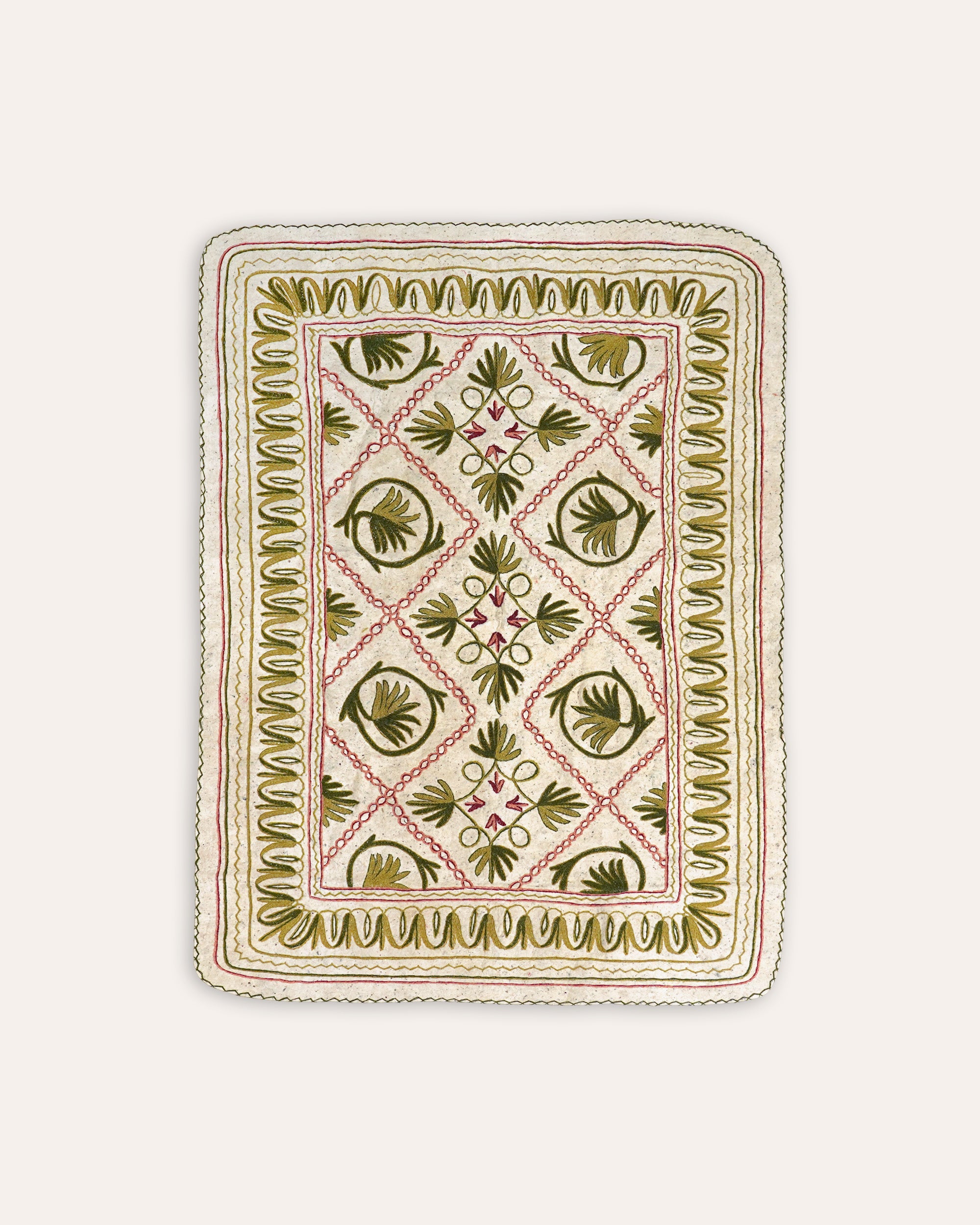 Embroidered fabric with geometric pattern on a white background