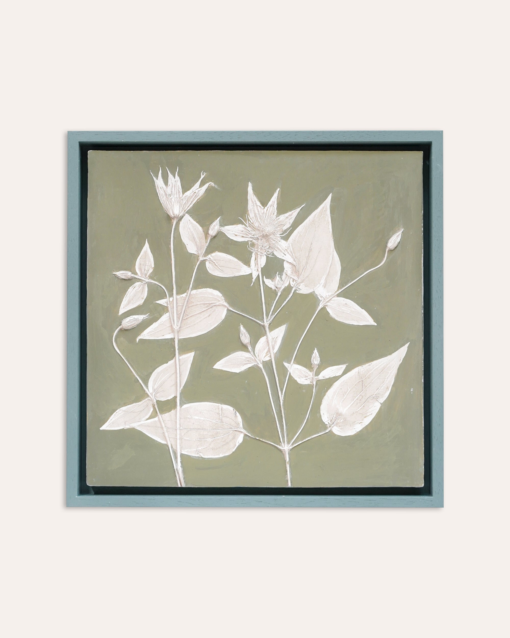 Framed botanical artwork by Imprint Casts with white leaves on a beige background