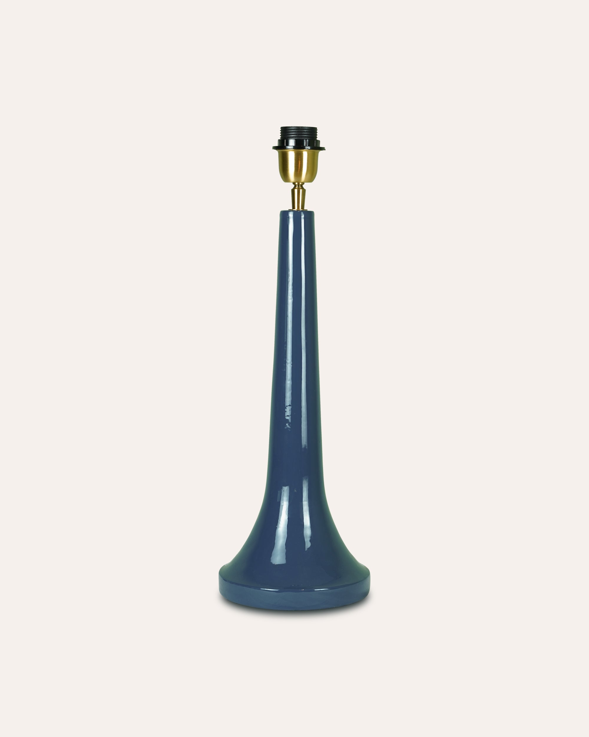 Blue lamp base with brass fitting on a white background