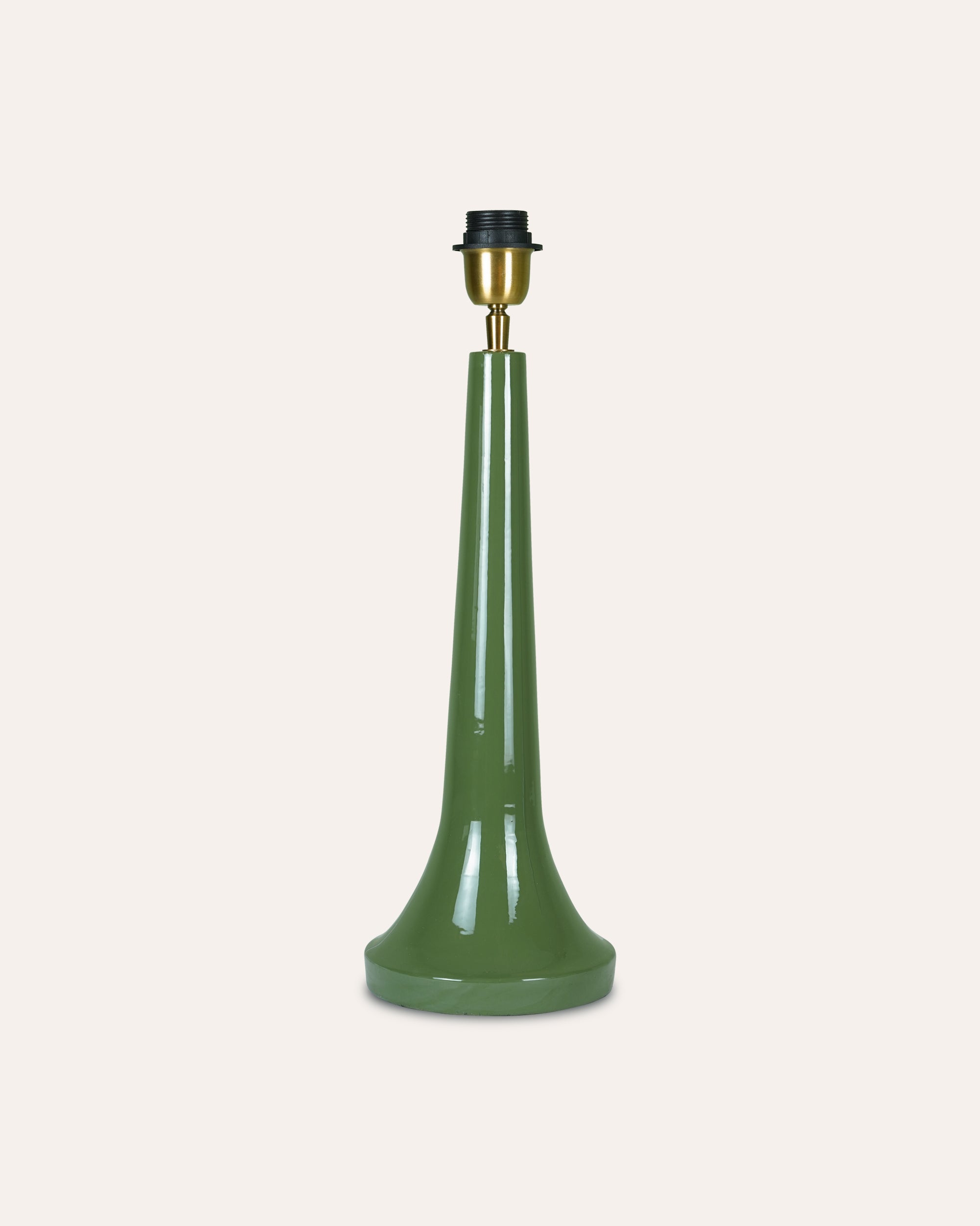 Green lamp base with brass fitting on a white background