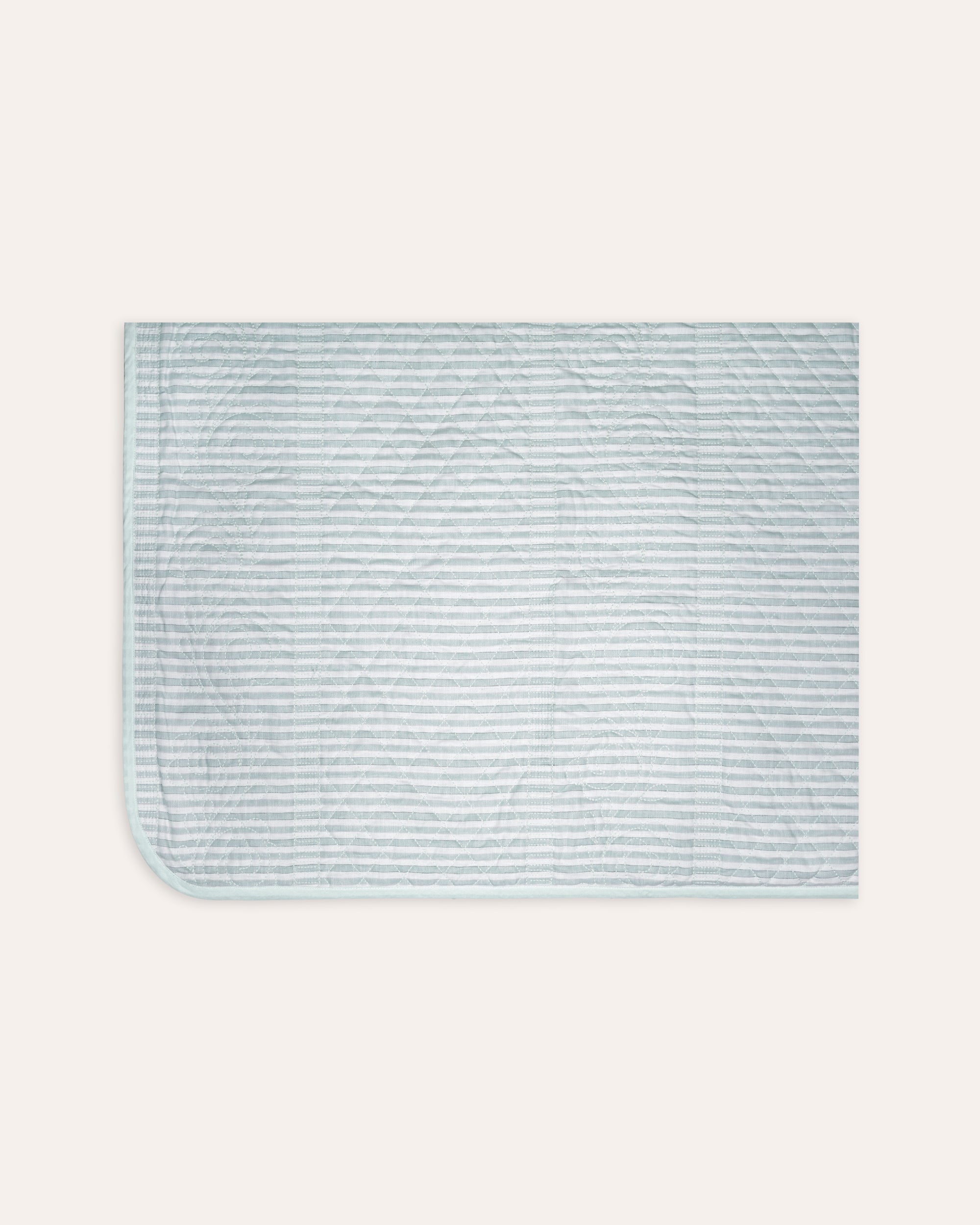 Rectangular bedspread with striped pattern on a white background