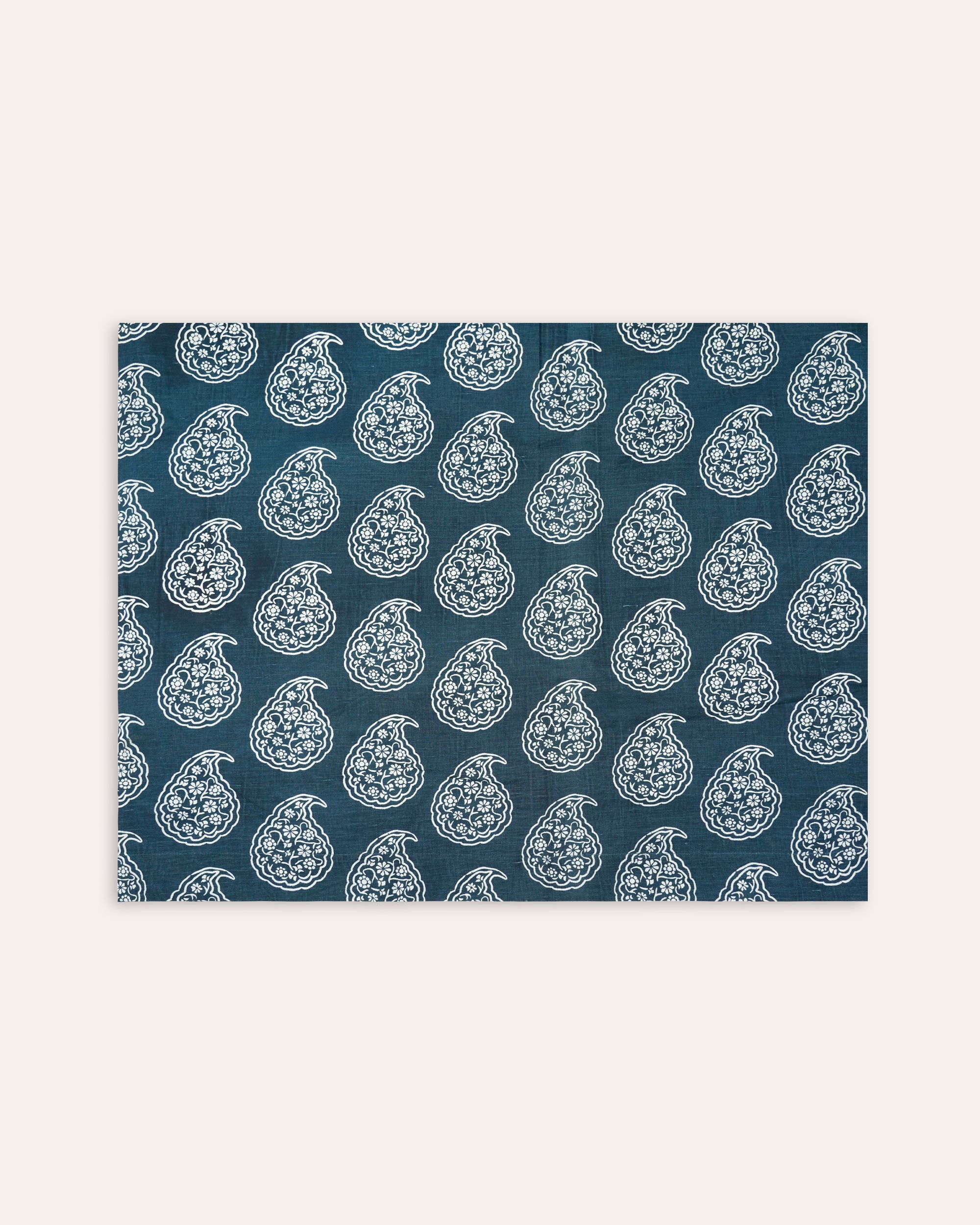 Patterned fabric with white designs on a blue background