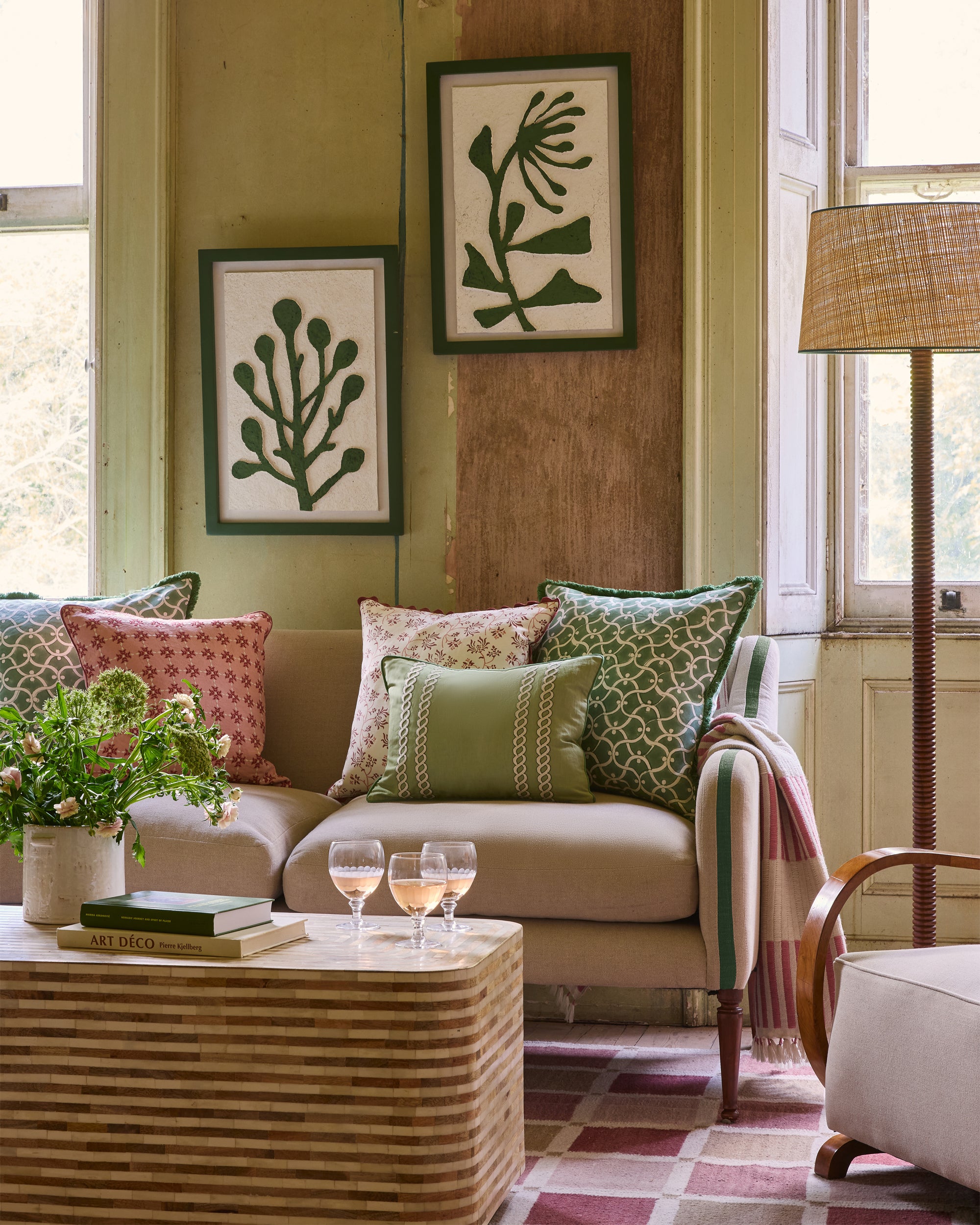 Living room with a beige sofa, decorative pillows, and a wooden coffee table.