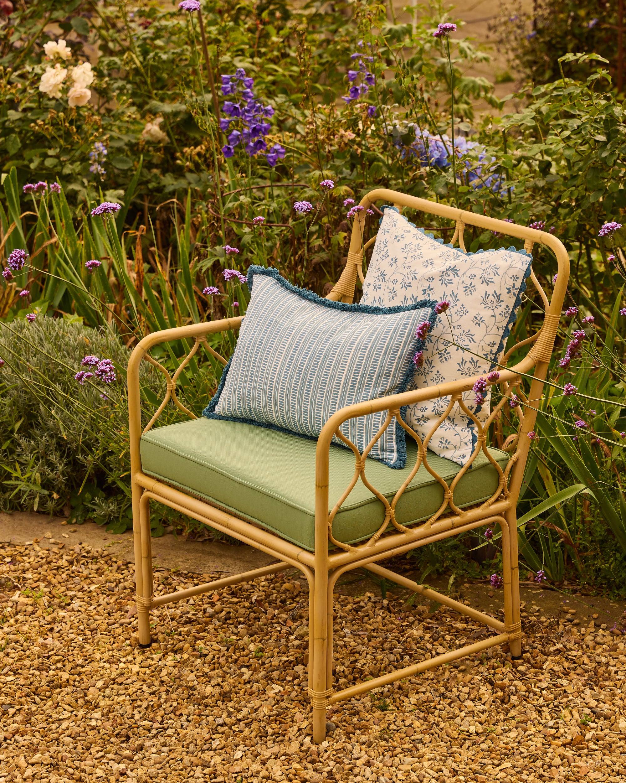 Aluminium chair with cushions in a garden setting