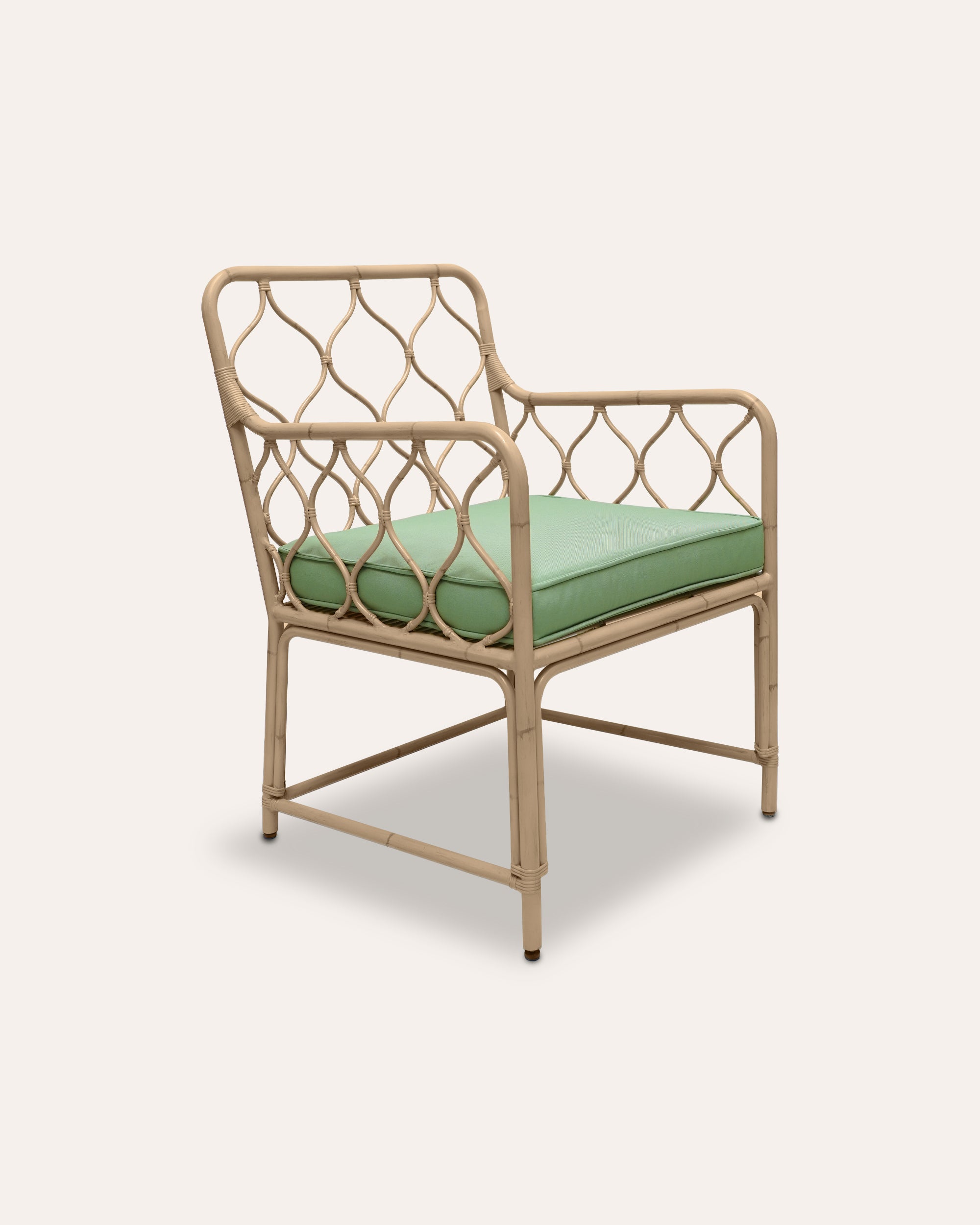 Natural Curato aluminium armchair with a green cushion on a white background