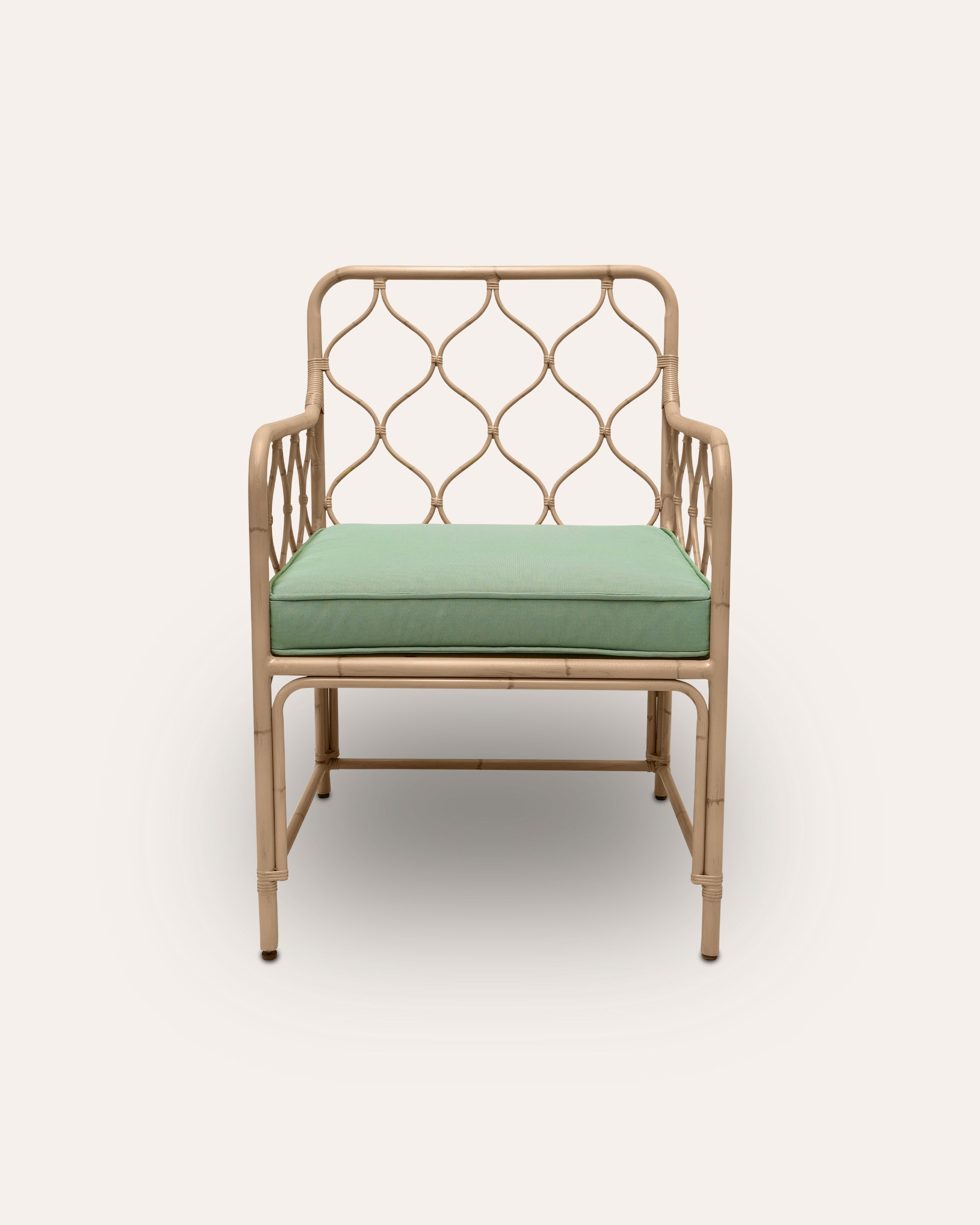 Curato armchair with a green cushion on a white background