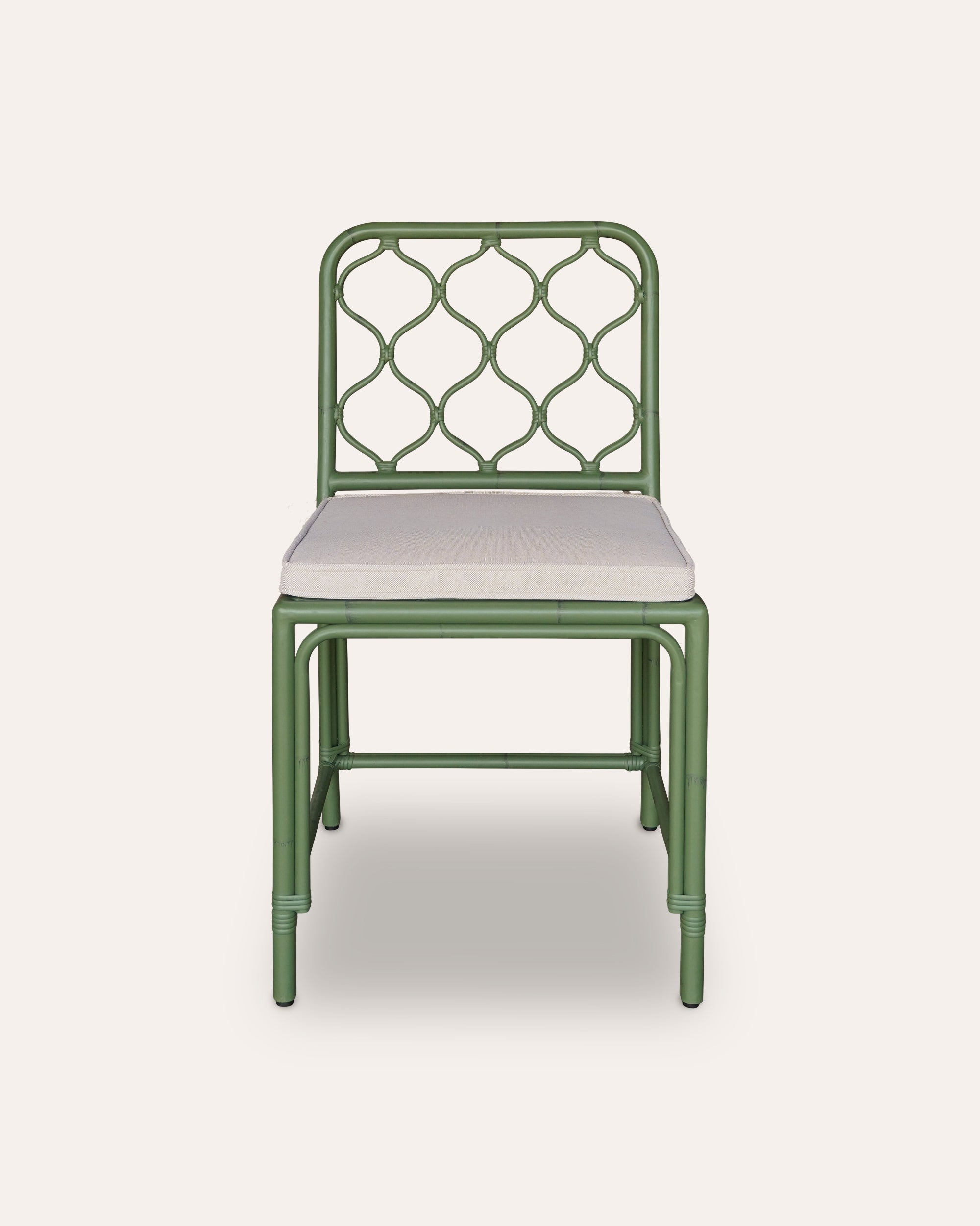 Green aluminium chair with a white cushion on a light grey background