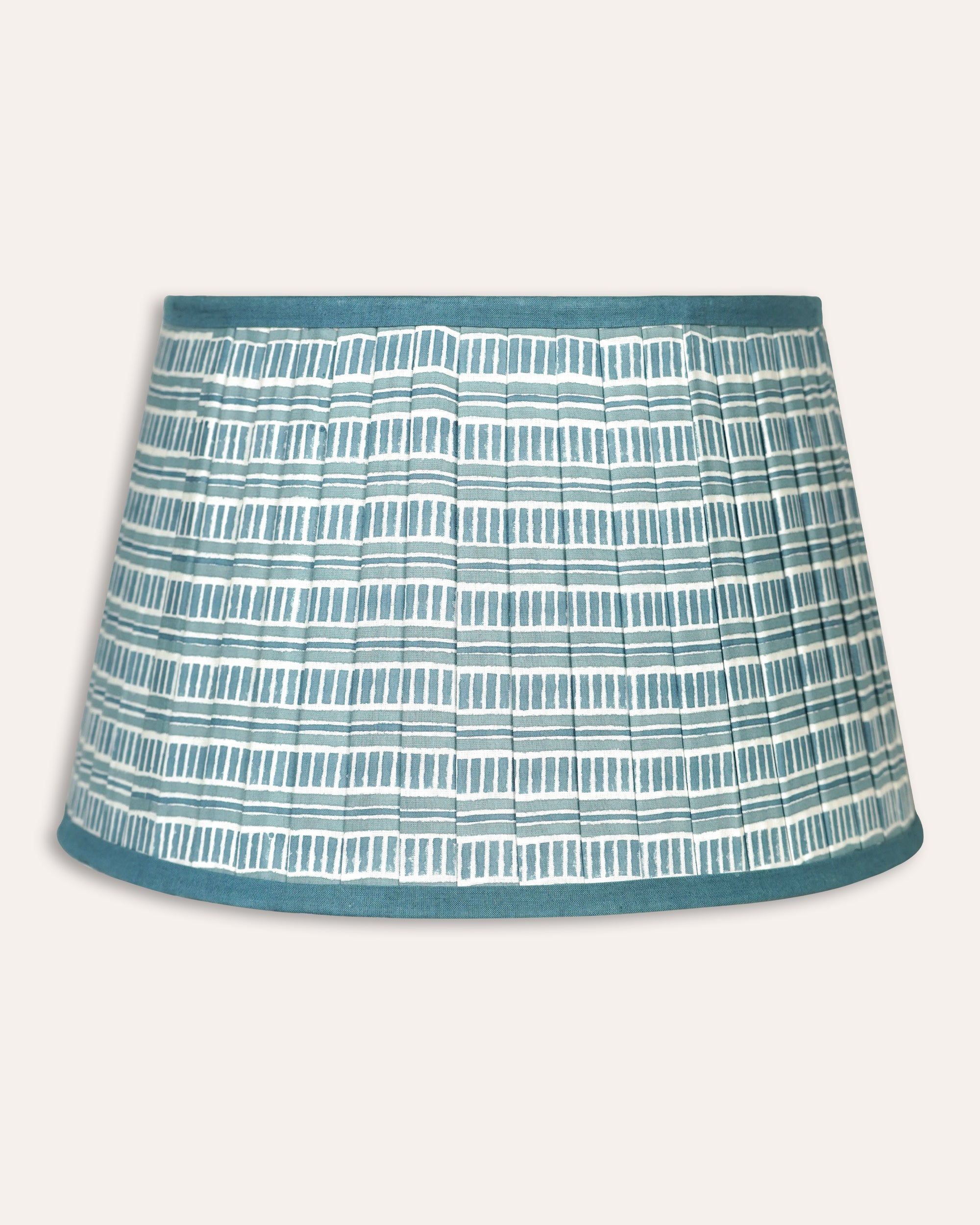 Textured blue and white lampshade on a light grey background